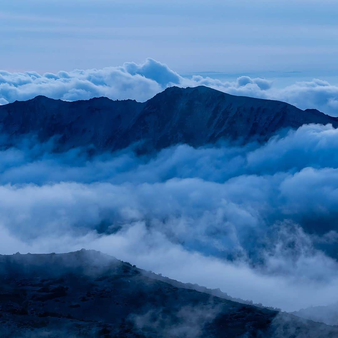 National Geographic Travelさんのインスタグラム写真 - (National Geographic TravelInstagram)「Photos by @stephen_matera | You might call it dusk or twilight, but photographers call it the blue hour. And for good reason. The color in this photo comes not from filters or Photoshop but from the color of the light that occurs naturally after the sun has set. Our brain will fool us into not seeing it, but the camera records the color of the light objectively. And here, the color adds to the mood of the clouds hovering around the mountains of the Central Cascades in summer, Mount Rainier National Park, Washington.   Follow me @stephen_matera for more images like this from Washington and around the world.」12月5日 8時50分 - natgeotravel