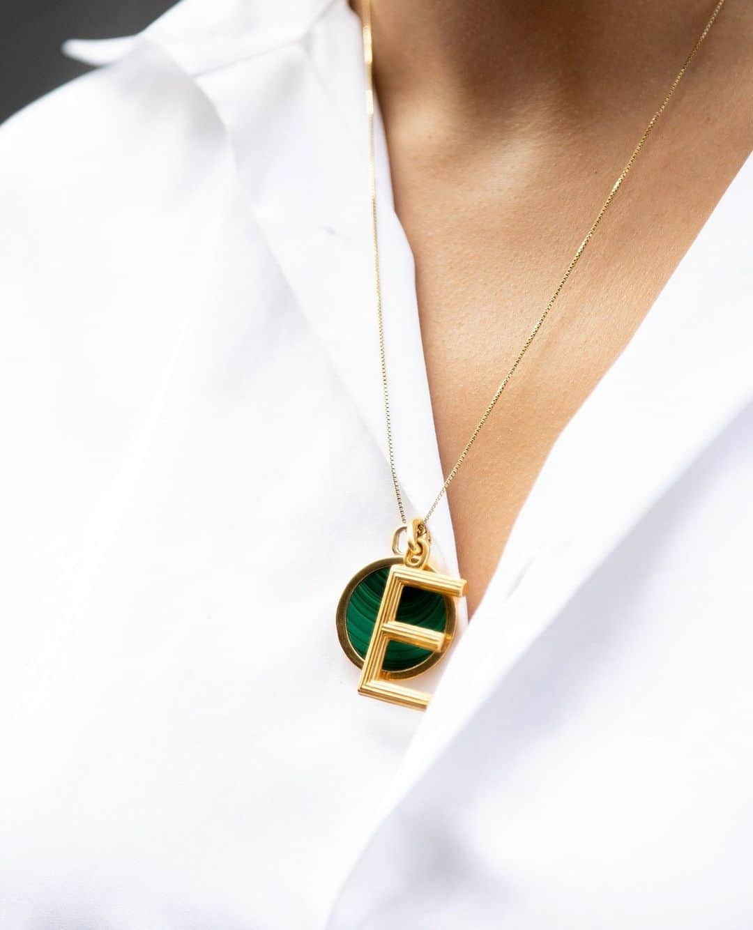 エステルデヴェのインスタグラム：「The "Large Alphabet" pendant in gold vermeil is threaded on the "Nouveau Réalisme" necklace in gold vermeil and malachite.」