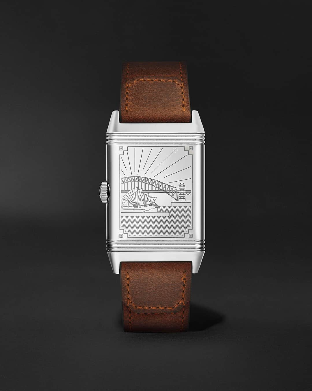 ジャガールクルトのインスタグラム：「The world on your wrist. #Reverso _ Reverso Classic Large Small Seconds Designed, made and assembled in our Manufacture _ Featuring a silvered guilloché dial on their recto, the Reverso Classic Large Small Seconds Cities edition available on Mr.Porter unveil three iconic cities on their verso, starting with Sydney’s fascinating skyline. All equipped with a Casa Fagliano leather strap, they feature the in-house hand-wound calibre 822 offering a 42-hour power reserve.   Available in limited quantities on mrporter.com _  #JaegerLeCoultre #Reverso #MrPorter」