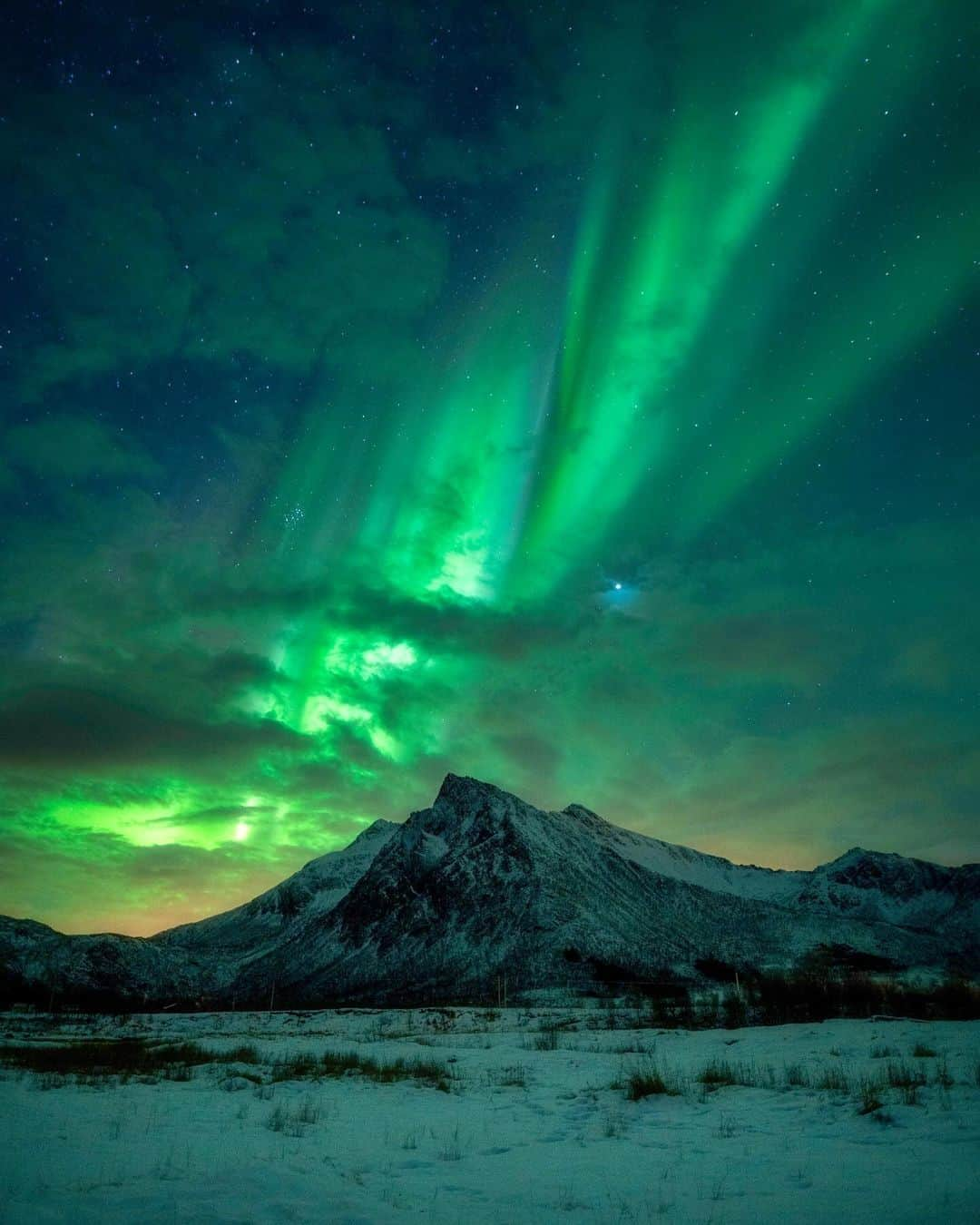 Travel + Leisureのインスタグラム：「Photo by @seffis 💫 Seeing photos and videos of the northern lights, you might be wondering, "Do they really look like that?" The answer is, well, sometimes. We've broken down everything you need to know about the aurora borealis, including how to see them, at the link in bio.」