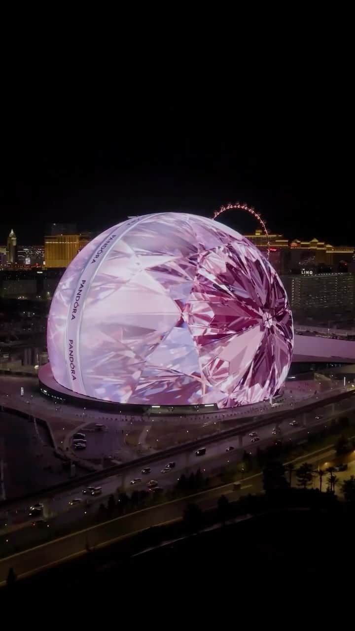 PANDORAのインスタグラム：「One day we had a thought: what if we created the world’s largest diamond? So we took over @spherevegas to do exactly that. 💎 Watch our immersive holiday unboxing experience come to life inside of a gorgeous pink diamond. #LovesUnboxed #LasVegas #pandorajewelry」