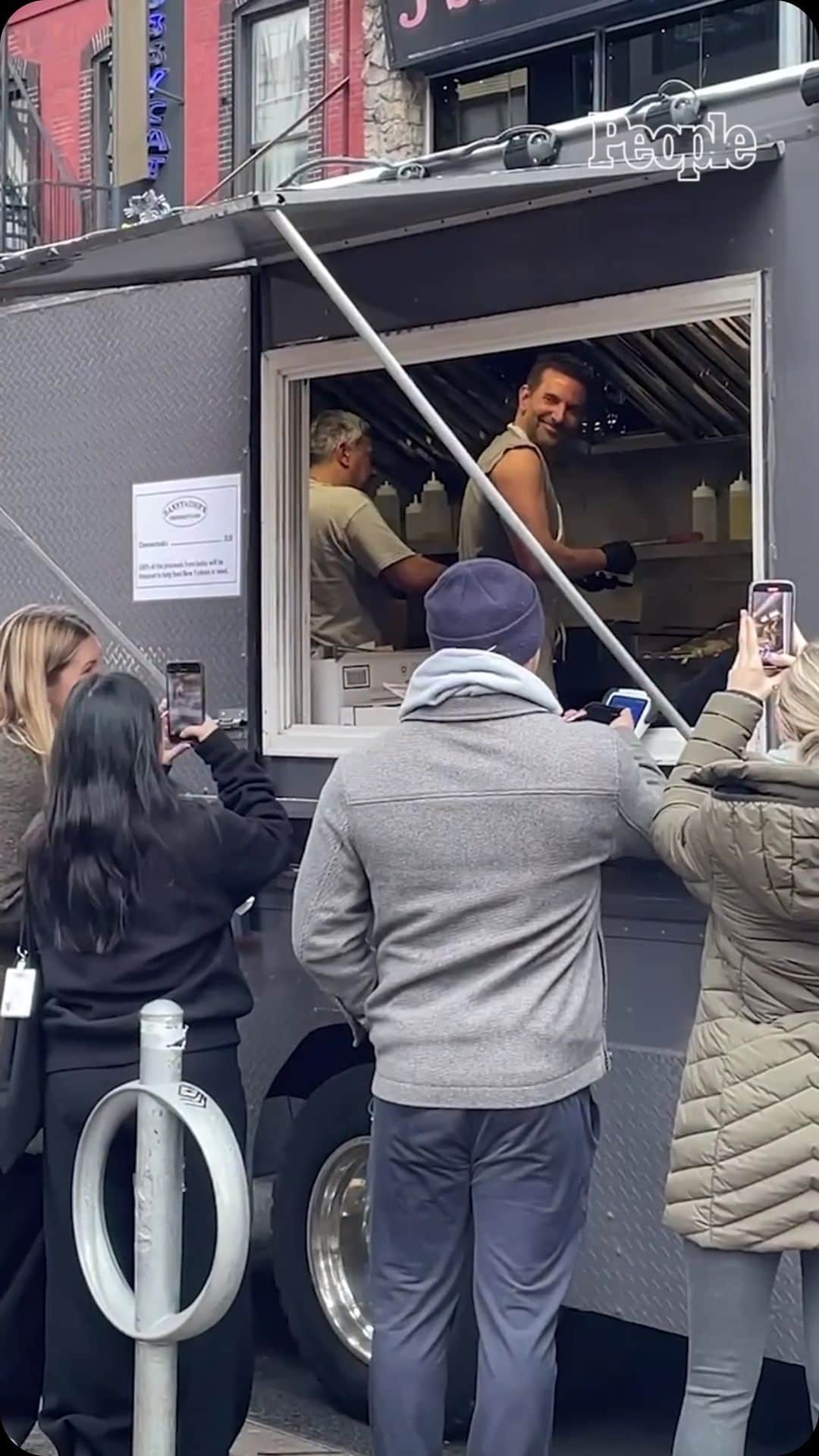 People Magazineのインスタグラム：「Bradley Cooper is ready to take your order! On Wednesday, the star took a break from Hollywood and stepped into a New York City food truck.   According to The Philadelphia Inquirer, Cooper and Angelo’s Pizzeria owner Danny DiGiampietro have partnered together to open Danny and Coops Cheesesteaks.   Get more details at the link in our bio.」