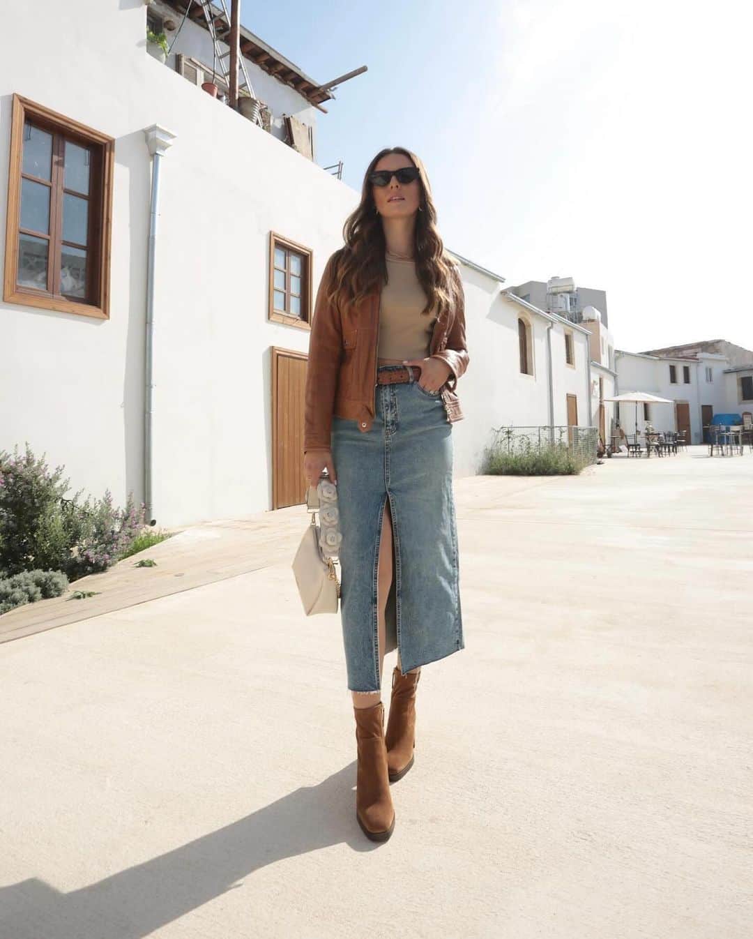 ALDO shoesのインスタグラム：「In our denim skirt era like #ALDOCrew @kristyagapiou styling her on-trend look with our Voss ankle booties and Annaleria shoulder bag, available in select regions. #AldoShoesCyprus」