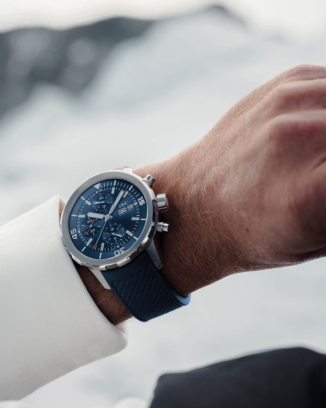 IWCのインスタグラム：「The striking blue hue of Lake Cauma inspires the choice of the Aquatimer Chronograph (Ref. IW376806) as we begin the next stage of our journey towards the source of the Rhine with @thealpinists. At sunrise, the water's edge reveals all the depth and beauty of its blue dial.  🔗Link In Bio  #IWCHolidaySeason | #TheOriginOfTime | #IWCAquatimer」