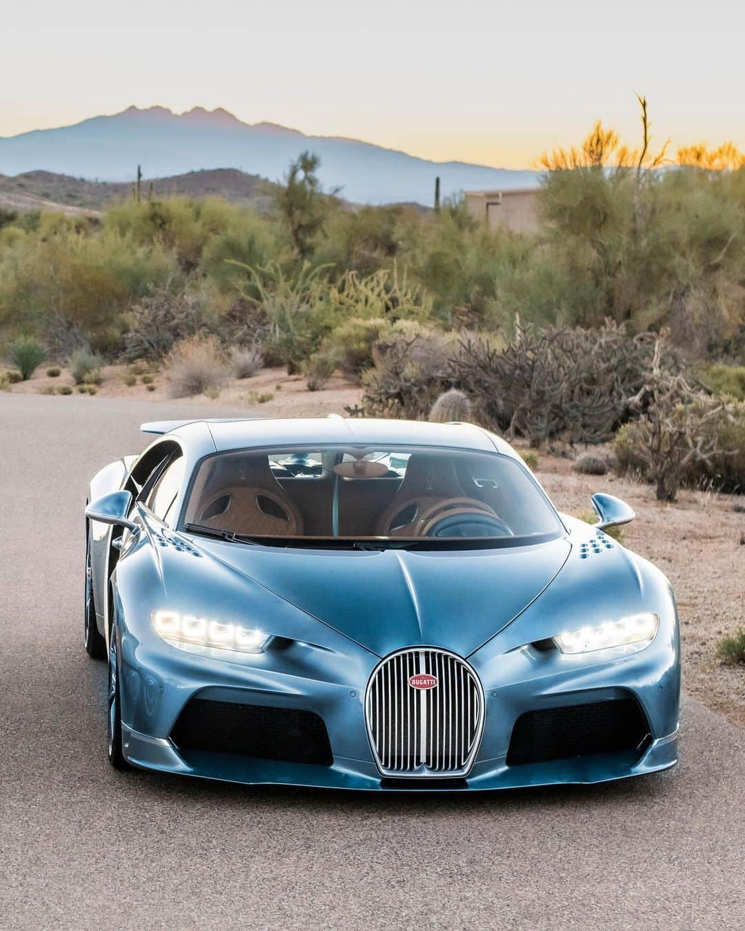 ブガッティさんのインスタグラム写真 - (ブガッティInstagram)「We celebrate a rare moment in automotive history: The CHIRON Super Sport ’57 One Of One’, BUGATTI’s most recent ‘Sur Mesure’ project, meets its paragon, the BUGATTI Type 57 SC Atlantic nearby the home of its current owner in the desert of Arizona.  It has been a lifelong dream of the CHIRON’s new owner to pay homage to the Atlantic, which she calls the most beautiful car in the world since she first saw it in the @MullinMuseum in Oxnard, California.   Now she finally achieved her goal with the creation of her CHIRON Super Sport that reinterpreted the iconic model – a birthday gift from her husband. “Everything is so perfect. I especially love how the colours match,” she adds full of admiration.  Co-created with the ‘BUGATTI Sur Mesure’ team, the development of the ‘57 One Of One’ was a labour of passion that stretched over a year.  #BUGATTI #CHIRONSuperSport #BUGATTISurMesure – WLTP: bugatti.link/consumption」12月9日 0時12分 - bugatti