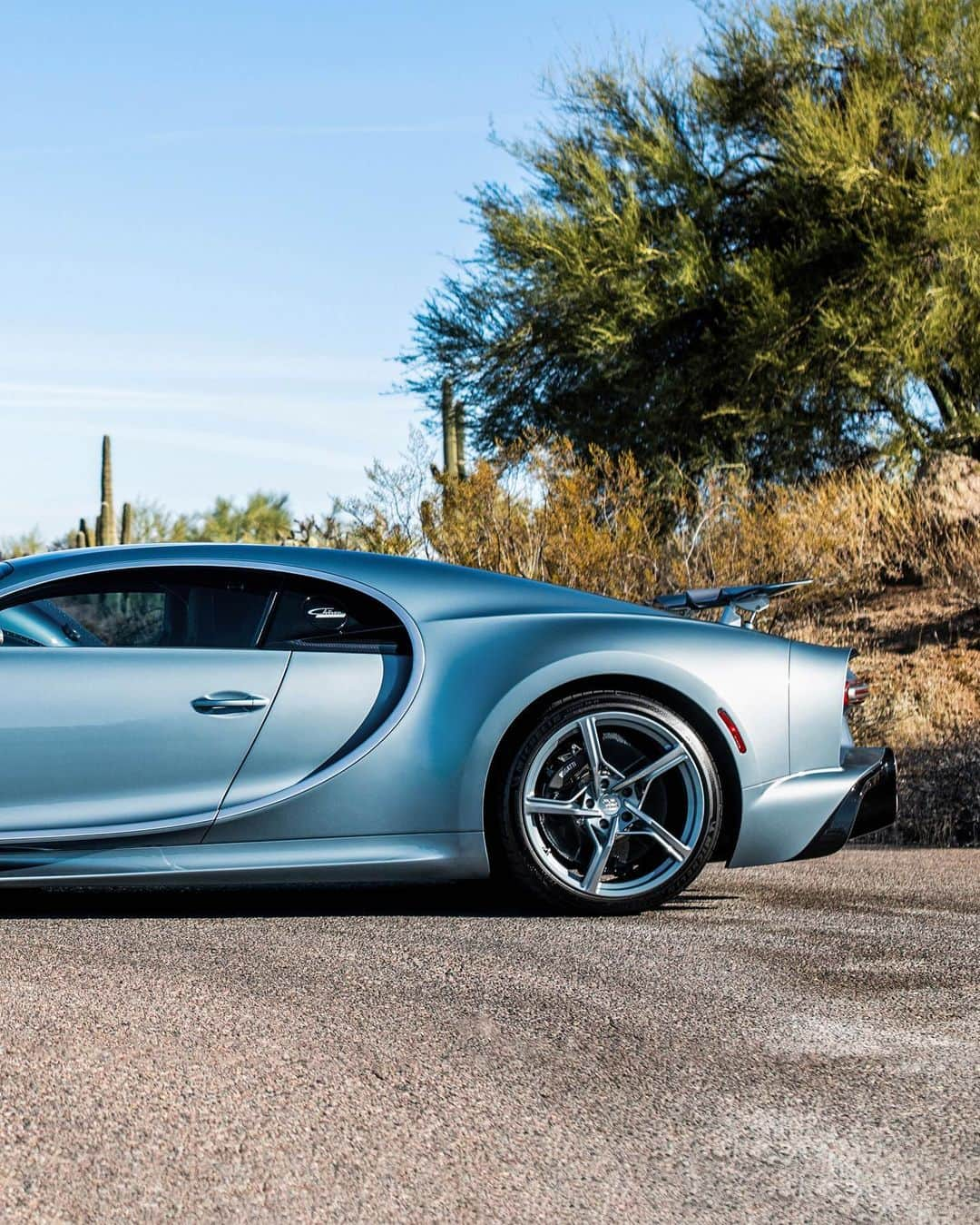 ブガッティさんのインスタグラム写真 - (ブガッティInstagram)「We celebrate a rare moment in automotive history: The CHIRON Super Sport ’57 One Of One’, BUGATTI’s most recent ‘Sur Mesure’ project, meets its paragon, the BUGATTI Type 57 SC Atlantic nearby the home of its current owner in the desert of Arizona.  It has been a lifelong dream of the CHIRON’s new owner to pay homage to the Atlantic, which she calls the most beautiful car in the world since she first saw it in the @MullinMuseum in Oxnard, California.   Now she finally achieved her goal with the creation of her CHIRON Super Sport that reinterpreted the iconic model – a birthday gift from her husband. “Everything is so perfect. I especially love how the colours match,” she adds full of admiration.  Co-created with the ‘BUGATTI Sur Mesure’ team, the development of the ‘57 One Of One’ was a labour of passion that stretched over a year.  #BUGATTI #CHIRONSuperSport #BUGATTISurMesure – WLTP: bugatti.link/consumption」12月9日 0時12分 - bugatti