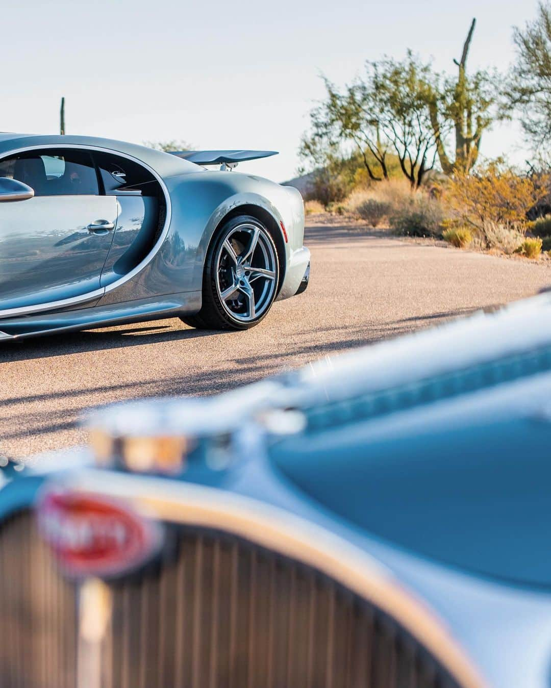 ブガッティさんのインスタグラム写真 - (ブガッティInstagram)「We celebrate a rare moment in automotive history: The CHIRON Super Sport ’57 One Of One’, BUGATTI’s most recent ‘Sur Mesure’ project, meets its paragon, the BUGATTI Type 57 SC Atlantic nearby the home of its current owner in the desert of Arizona.  It has been a lifelong dream of the CHIRON’s new owner to pay homage to the Atlantic, which she calls the most beautiful car in the world since she first saw it in the @MullinMuseum in Oxnard, California.   Now she finally achieved her goal with the creation of her CHIRON Super Sport that reinterpreted the iconic model – a birthday gift from her husband. “Everything is so perfect. I especially love how the colours match,” she adds full of admiration.  Co-created with the ‘BUGATTI Sur Mesure’ team, the development of the ‘57 One Of One’ was a labour of passion that stretched over a year.  #BUGATTI #CHIRONSuperSport #BUGATTISurMesure – WLTP: bugatti.link/consumption」12月9日 0時12分 - bugatti