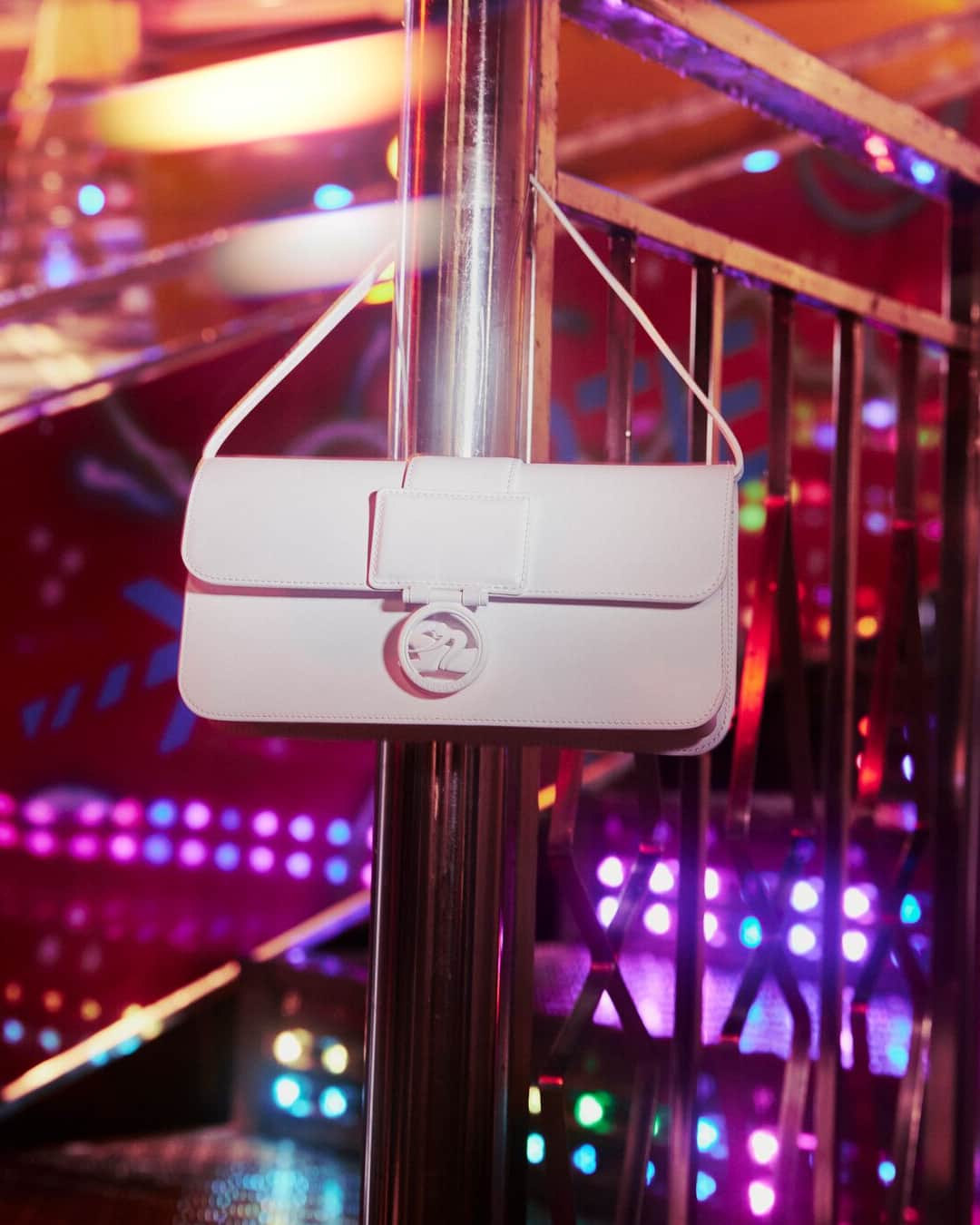 Longchampのインスタグラム：「The one and only.  Collection: #ParisIsAParty Bag: #LongchampBoxTrot  Photographer: @guillaumesanner  #Longchamp #Parisisaparty #endoftheyear #newcollection #LongchampSS24 #christmas #christmasoutfit #newyear2024 #newyearoutfit #party #giftideas #whitebag #handbag #leatherbag #longchampbag #partyvibes #accessories」