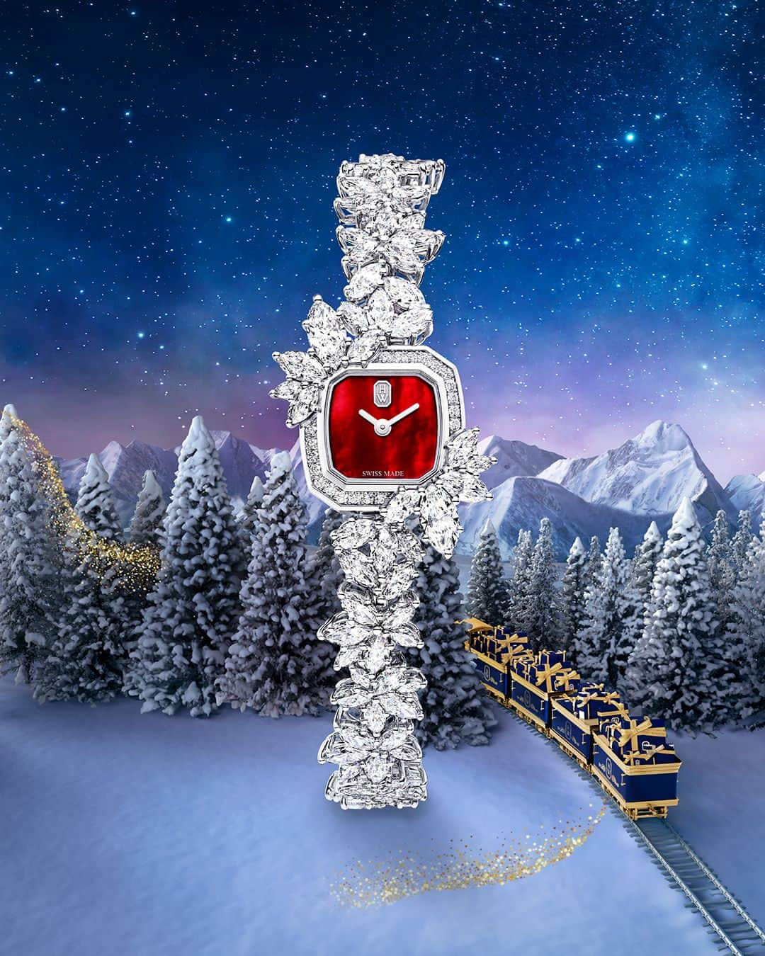 ハリー・ウィンストンのインスタグラム：「On the Winston Express, time is a treasure. With an intense red mother-of-pearl dial and a clustering setting that recalls a wintry landscape, this Precious Emerald timepiece is bound to dazzle this holiday season. Share sparkling moments in time with your loved ones—link in bio. #WinstonWishes #HarryWinston」