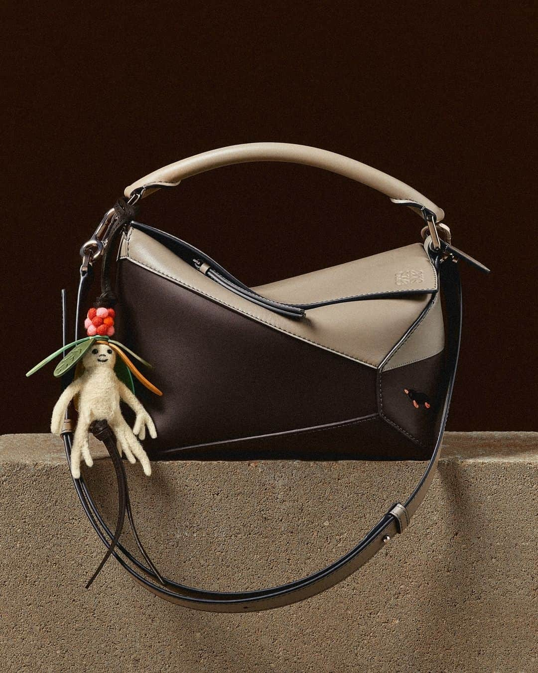 Loeweのインスタグラム：「The Puzzle Edge bag in leather with a Mandragora charm in cotton and linen.  LOEWE will donate part of the proceeds from every LOEWE x Suna Fujita purchase to Save the Children's Education in Emergencies programme, which works to guarantee safe learning environments for children in humanitarian crisis situations around the world.  See our gifting edit on loewe.com   #LOEWE #LOEWEpuzzle」