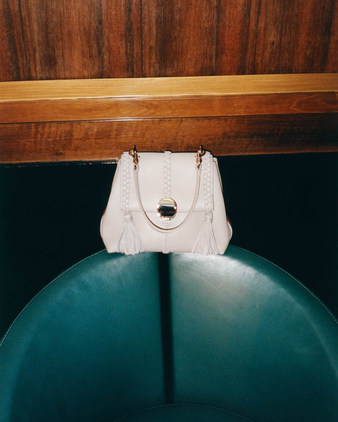 Chloéのインスタグラム：「With its rounded silhouette and artisanal details including leather braiding and signature coin closure, the Penelope soft shoulder bag will carry you from day to night this party season.」