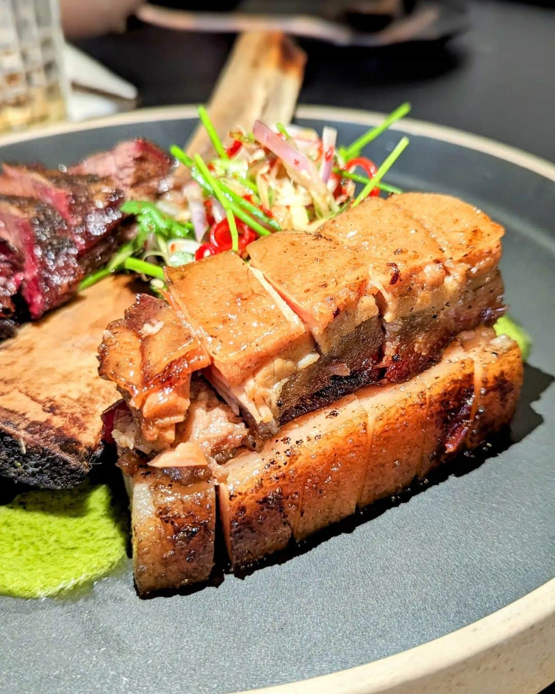 Li Tian の雑貨屋のインスタグラム：「Pork like no other 🐷 Korean chef Yong from the hottest Asian smokehouse in town comes up with this terrific char siu pork belly that is nothing I've had before. The pork belly is first sous vide before smoked, resulting in a gelatinous melting texture that's nothing like the crunchy (crispy) kind of pork belly. Lightly sweetened and a joy to dig in -without the need for any sauce.   Sitting opposite is the Korean Short Ribs, which might be mistaken as beef at first sight. Yes, fall-of-the-bone tender yet slightly charred and crusty on the edges. It's meaty and well-marinated. Trust the folks here to whip up stunning smoked meats cos it's truly above the rest.   📌 @liberty.singapore  MBFC Tower 2 #01-04  Opens for lunch and dinner   #sgfood #smokedhouse #meat #sgfoodie #sgblog  #newopen」