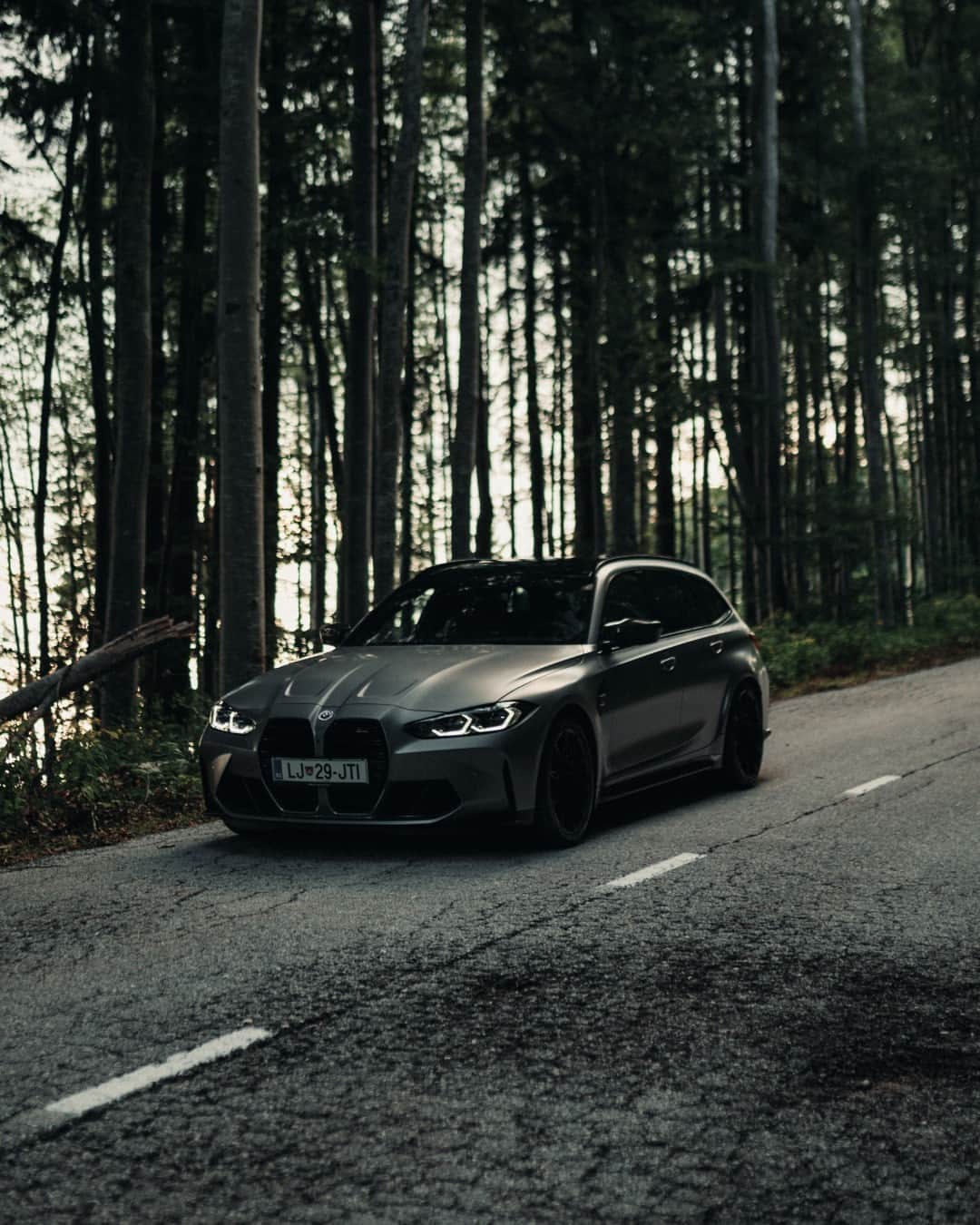 BMWのインスタグラム：「Roaming the woods, where performance meets serenity 🏁 📸: @klemen_jeram @bmwslovenija #BMWRepost   The BMW M3 Competition xDrive Touring. #THEM3 #BMWM #M3 #M3Touring #BMW #MPower __ BMW M3 Competition xDrive Touring: Combined fuel consumption: 10.4–10.1 l/100 km. Combined CO2 emissions: 235–229 g/km. All data according to WLTP. Further info: www.bmw.com/disclaimer」