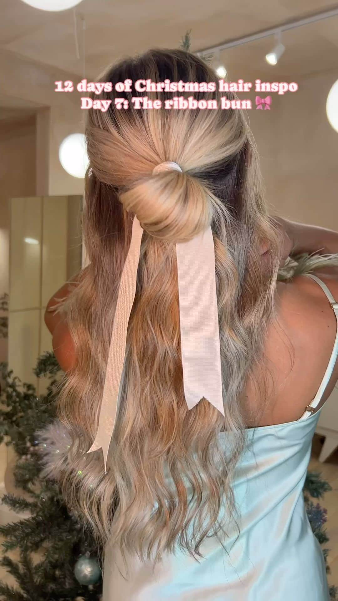 ghd hairのインスタグラム：「✨12 DAYS OF CHRISTMAS HAIR INSPO✨ Day 7: The ribbon bun 🎀💫 Save for your next Christmas event☁️   #ghd #ghdhair #christmashair #festivehair #xmashair #holidayhair #bowhair #bow #ribbon #hairbow」