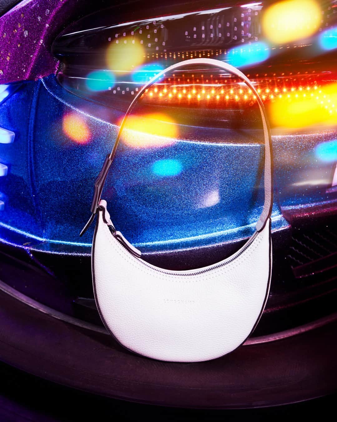 Longchampのインスタグラム：「Smile and shine.  Collection: #ParisIsAParty Bag: #LongchampRoseau Photographer: @guillaumesanner  #Longchamp #Parisisaparty #endoftheyear #newcollection #LongchampSS24 #christmas #christmasoutfit #newyear2024 #newyearoutfit #party #giftideas #whitebag #handbag #leatherbag #longchampbag #partyvibes #accessories」
