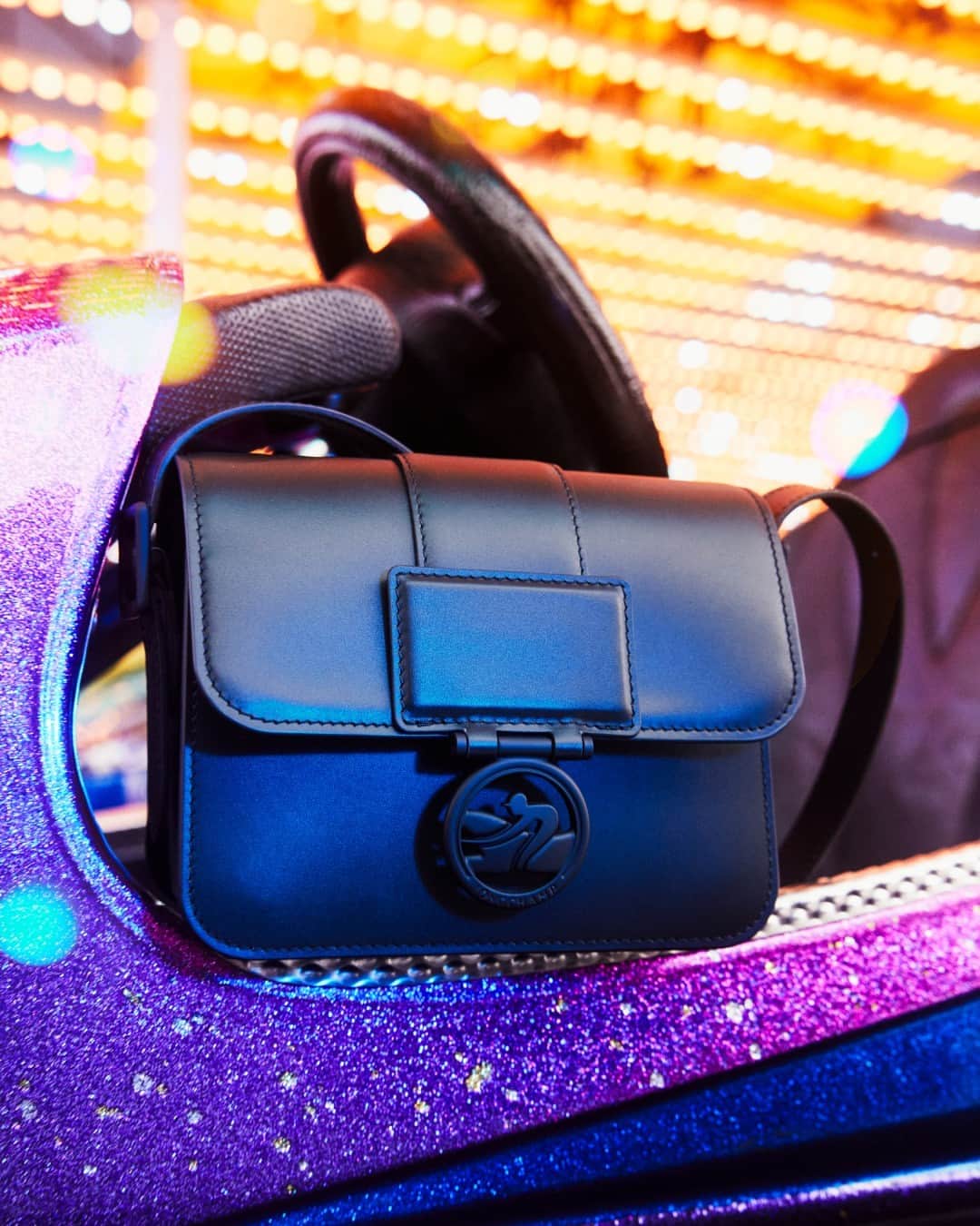 Longchampのインスタグラム：「Last minute gift, part 1.  Collection: #ParisIsAParty Bag: #LongchampBoxTrot Photographer: @guillaumesanner  #Longchamp #Parisisaparty #endoftheyear #newcollection #LongchampSS24 #christmas #christmasoutfit #newyear2024 #newyearoutfit #party #giftideas #blackbag #handbag #leatherbag #longchampbag #partyvibes #accessories」