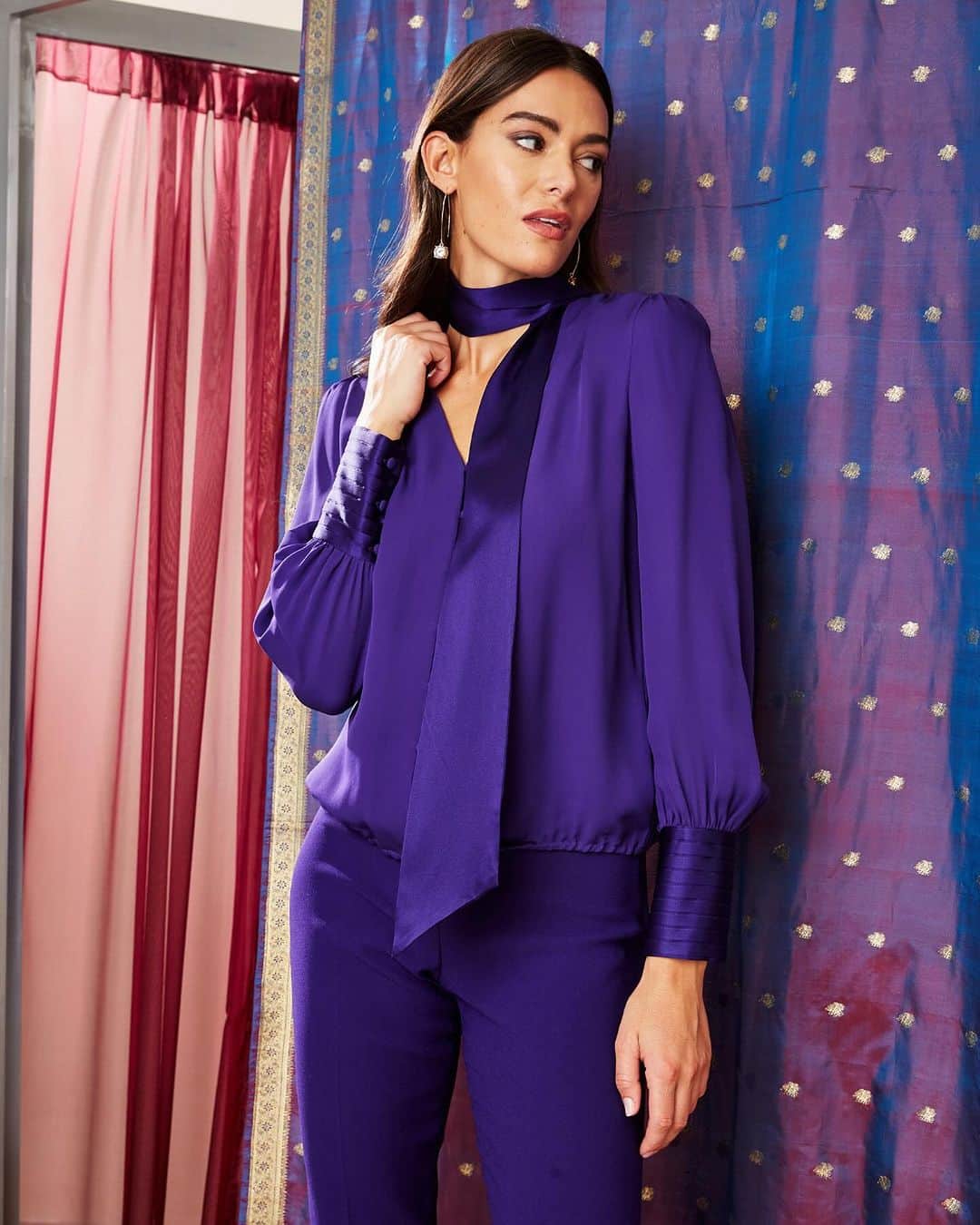 エリータハリのインスタグラム：「Elegance meets femininity in Winterplum! 💜 Our Blouson Satin Tie Shirt, crafted in Silk Georgette, is a winter essential.   Exclusively available at elietahari.com & Elie Tahari Collection Stores.」