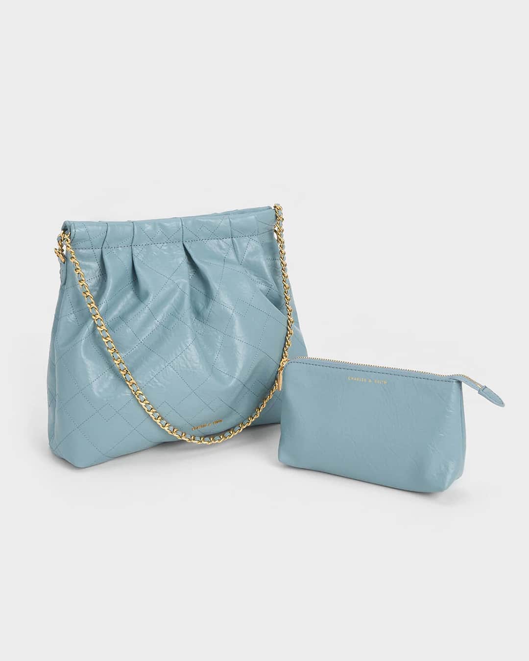 のインスタグラム：「Embrace understated elegance with the stylish and practical Duo hobo bag, crafted in a muted slate blue finish.  Shop now via the link in bio.  #CharlesKeithOfficial  Product featured: Duo Double Chain Hobo Bag」