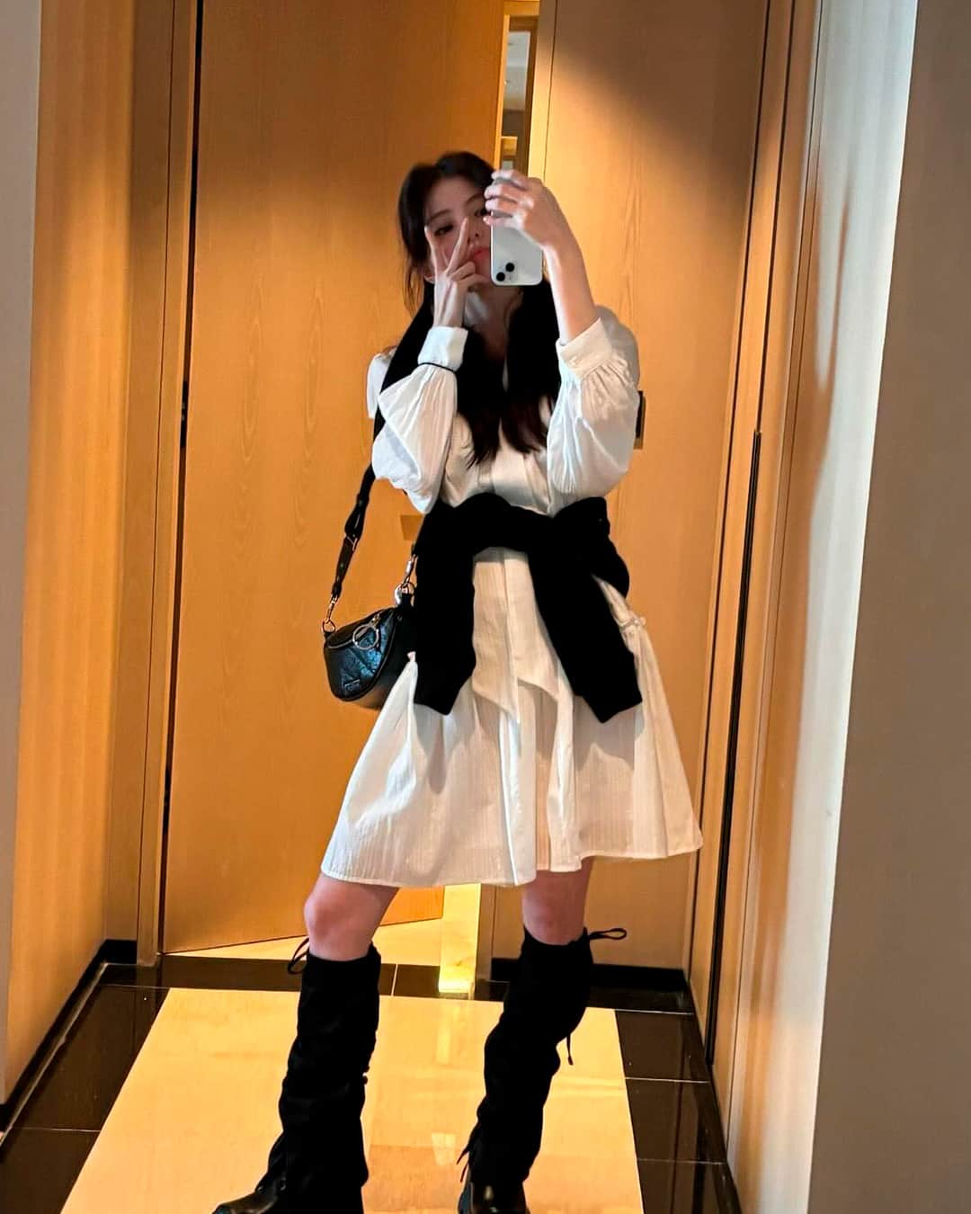 CHARLES & KEITHのインスタグラム：「Actress Han So Hee was spotted in our white Triana platform ankle boots and Philomena half-moon crossbody bag in noir while travelling in Hong Kong.  Shop now via our link in bio.  @xeesoxee #HanSoHeexCharlesKeith #ImwithCharlesKeith」