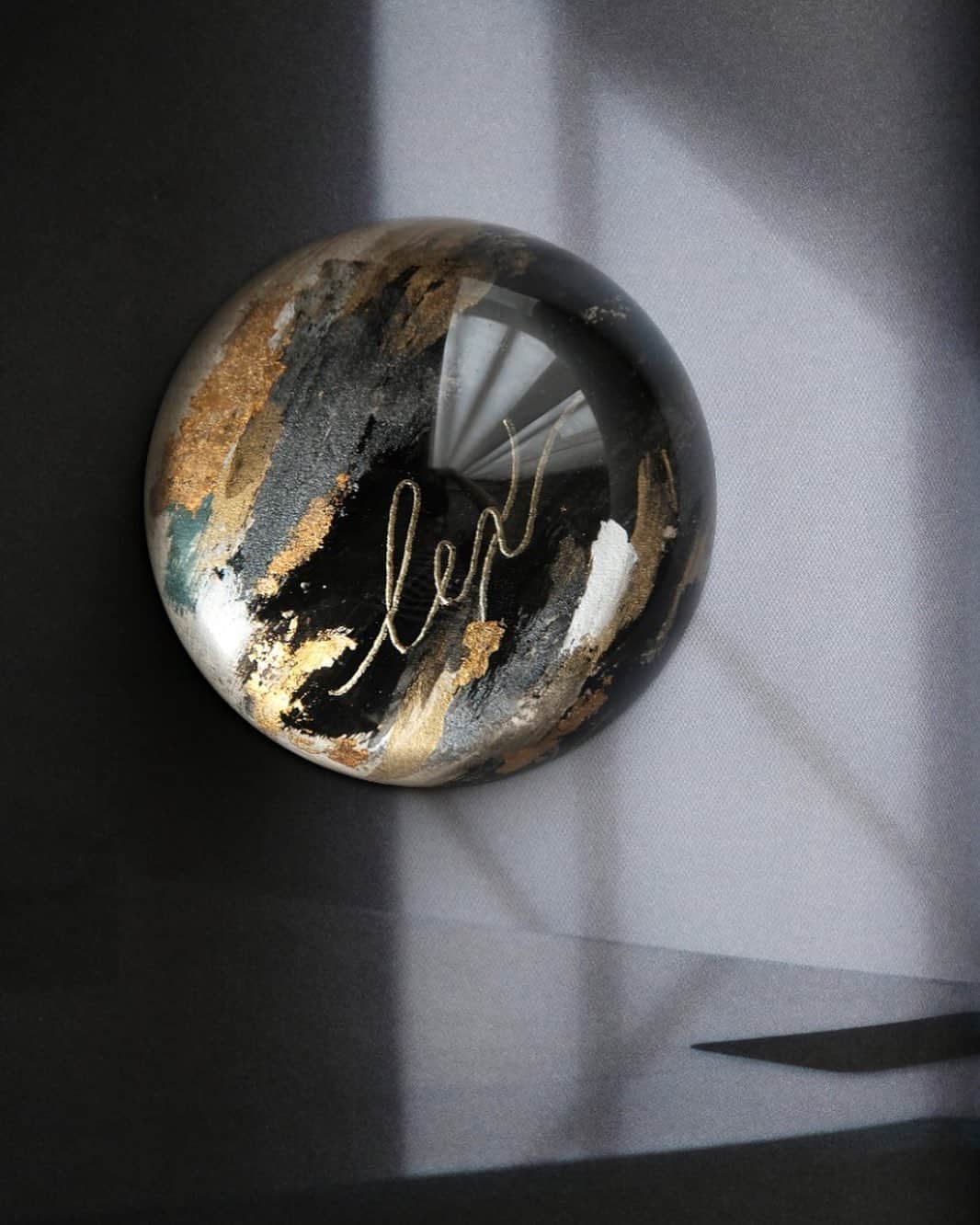 のインスタグラム：「Capturing The Lex Universe in this precious dome @alexandergotama — #paperweight #domeproject  #truffypi #painting #madetoorder #mixmedia #pastel #glass #calligraphystyling #tabletop #stationery #カリグラフィースタイリング  #artobject #waterdrop #bespokestationery」