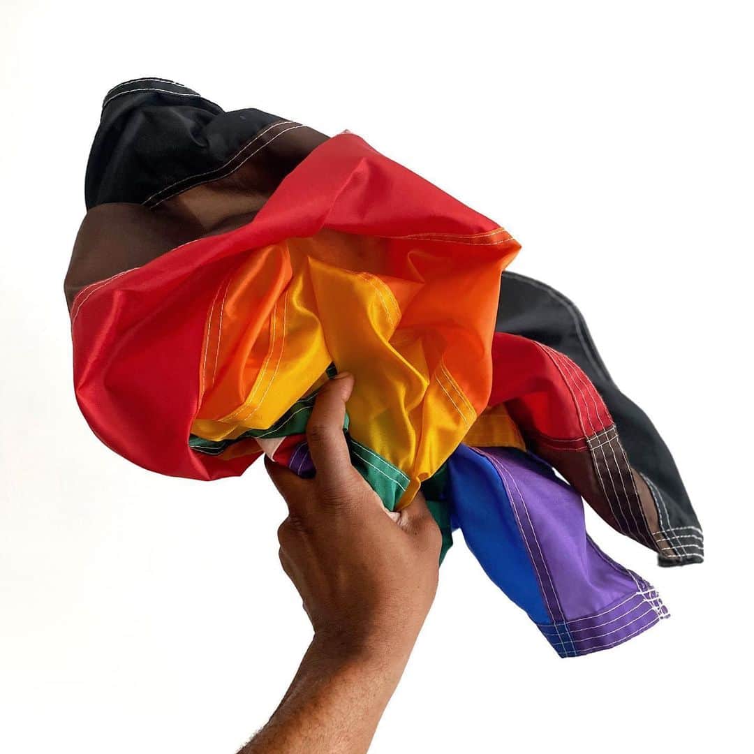 Paul Octaviousのインスタグラム：「My rainbow flag includes the brown and black stripes. The black and brown stripes draw attention to issues of people of color within the LGBTQ communities.  June 1 starts the season of Pride. At this time normally your feed is filled with rainbow overload, but this year is a bit different (FYI to the gay community and influencers, and brands who didn’t get the memo)  Yesterday evening I was really emotional and happy that the peaceful protest would walk through my neighborhood and I hung my flag on my porch with Pride.  As the day went on I got a message from a friend & neighbor that read: “Hey Paul… Just FYI a neo Nazi group have targeted our neighborhood & destroying / defacing  the properties of African Americans, homosexuals and trans community members. Please Stay home.” Without skipping a beat I put my call on hold and I grab the flag and took it in. “Hey sorry about that I just had to do something.  I’m very proud to be of the community and hate scare tactics wether true or rumor.  The protest that passed my home was beautiful. To see black and brown folks alongside white allies still marching for what is right had me in tears while I had my fist in the air.  I’ll hang the flag again, just giving it some rest.  Be safe, evaulate how you share and use your voices during these times and check in on your friends.  This is rough seas we’re in but the boat has always been the same.  #blackpride #pride🌈 #useyourvoice」