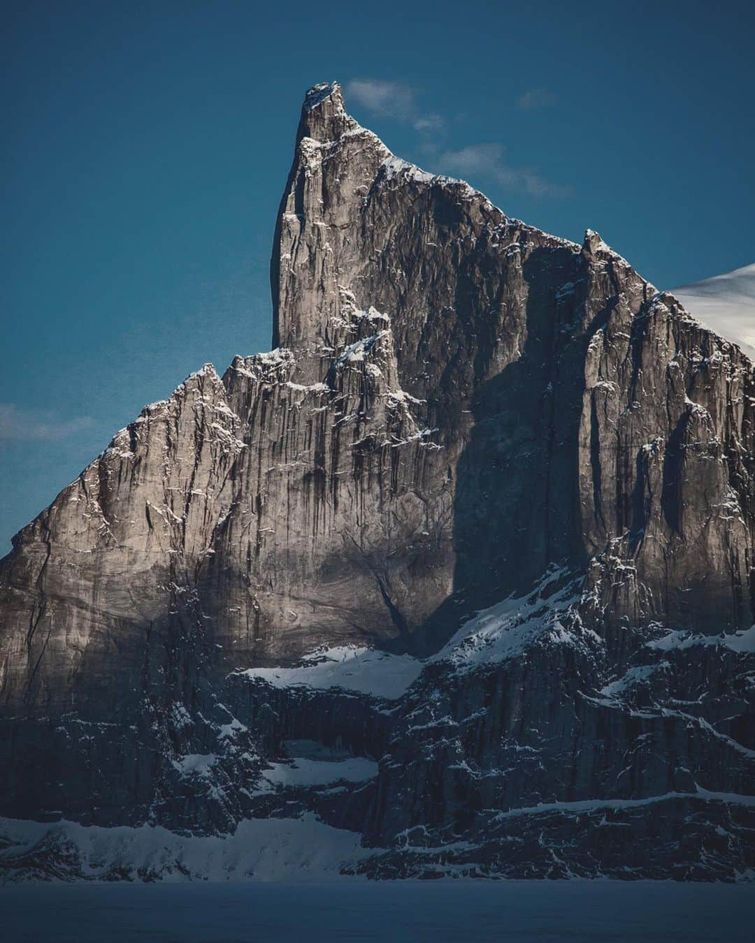 ジミー・チンさんのインスタグラム写真 - (ジミー・チンInstagram)「Monday mountain meditation. Polar Sun Spire - Baffin Island. The 4300ft north face is probably one of the steepest continual walls on earth. ⁣ ⁣ Digging through the archives these last few weeks (and the forseeable future) as I’m finally putting together a photo book... ⁣ Found a series of long forgotten images from one of the most expedition-like commercial shoots I’ve ever done. Real stakes, a lot of unknowns, challenging shooting conditions and plenty of high end action - including what was probably the first three way ski BASE ever done. What a team and what an adventure... A nice jaunt down memory  lane. ⁣  Check the vid on the third slide - that’s called performing casually under pressure. ⁣ Vid by @dirkcollins ⁣ ⁣ BASE Jumper @jtholmesjr ⁣ ⁣ @rsafilms @adymoat」5月12日 2時16分 - jimmychin