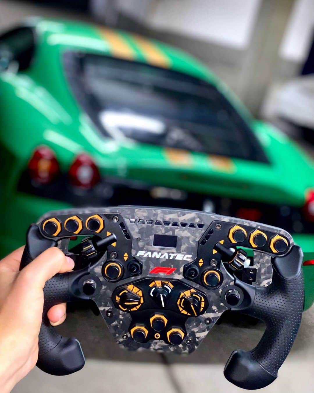 のインスタグラム：「Booty view of @papeclassics green / gold F430 Scuderia💚🧡 in combo with the new limited @fanatec_official F1 steering wheel 👏🏽💥 1/2020 lovin’ it 😏 || *anzeige* || #sophia #sophia99 #racegirl #changeagent #motorsport #racing #esports #wheel #steering #FANATEC #ferrari」