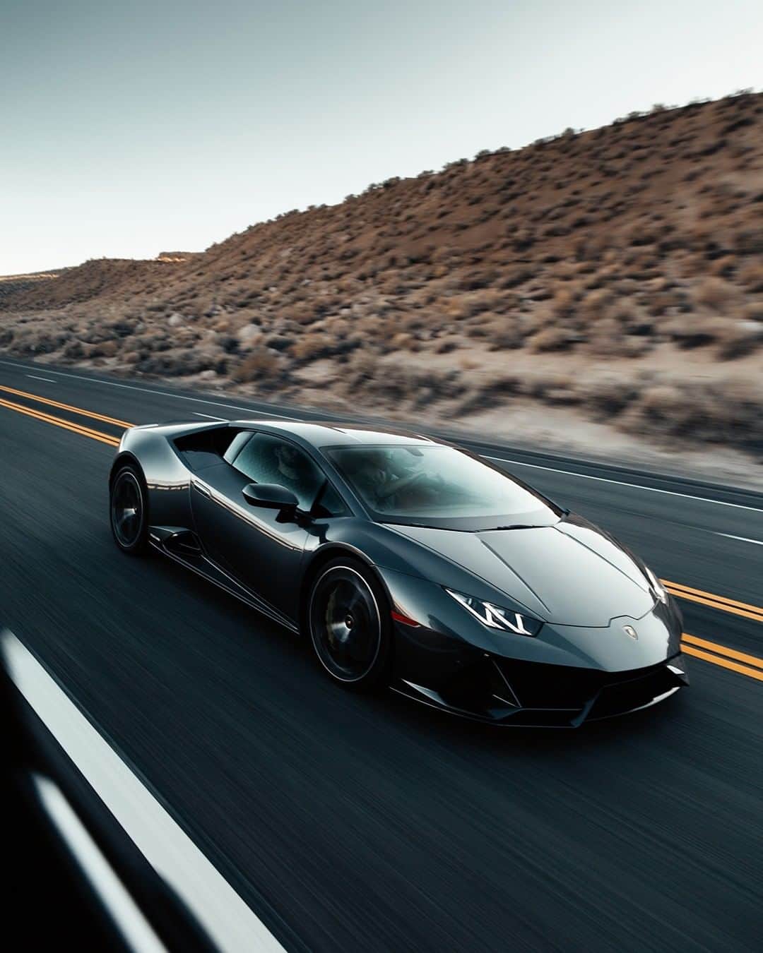 ランボルギーニのインスタグラム：「With extraordinary partners, a journey becomes an adventure.  Introduced as the pinnacle of evolution, Lamborghini's Huracán EVO offers an agile driving experience, letting you explore a plethora of emotions. Captured by @moliverallen.  #Lamborghini #HuracanEVO #EveryDayAmplified」