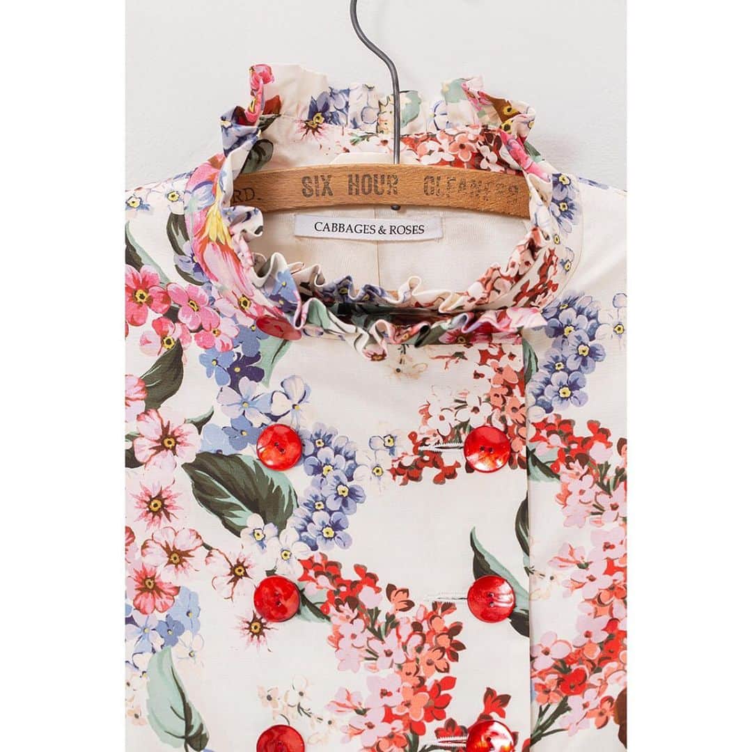 キャベジズ&ローゼズのインスタグラム：「Good enough to eat. Shiny red organic buttons on beautiful Italian floral fabric. Wear short with the Angelica coat or A line in the Elsie coat. @christina_strutt @cabbagesandroses_shop @scottlongjphoto #organic #redbuttons #allinthedetails #goodenoughtoeat #madewithlove #madeinengland #florals #floralstories #summervibes」