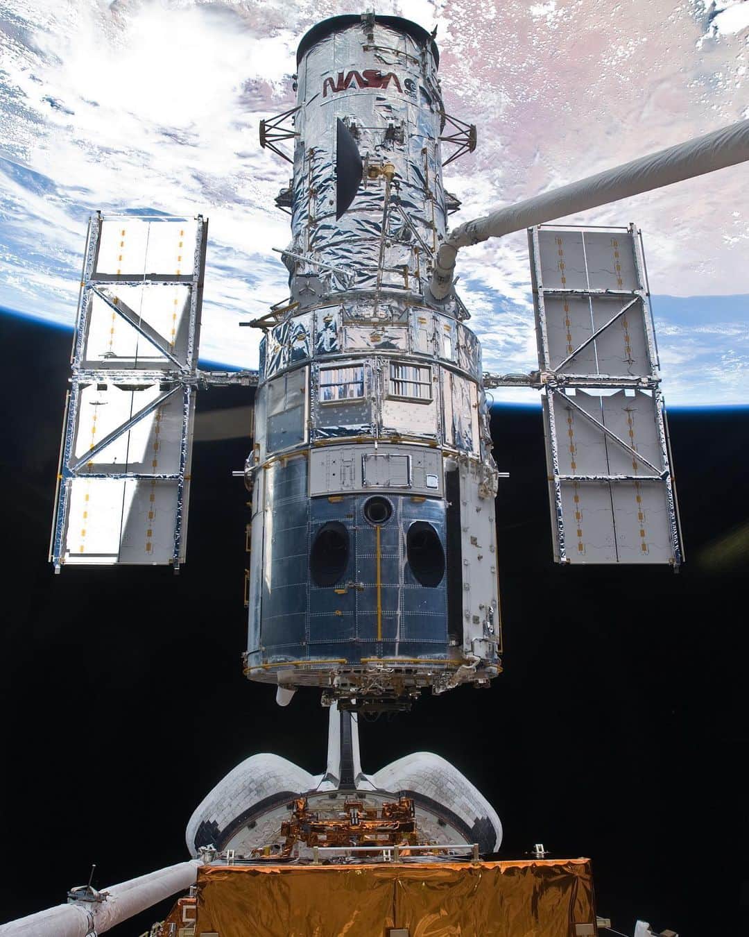 NASAさんのインスタグラム写真 - (NASAInstagram)「#OTD in 2009, after astronauts completed upgrades and repairs, @NASAHubble was released to resume observing the universe. ⁣ 🌌 ⁣ In this image, space shuttle Atlantis' remote manipulator system arm lifts the telescope from the shuttle's cargo bay moments before release. ⁣ ⁣ This was the fifth and final servicing mission for Hubble. Over five spacewalks, astronauts installed two brand-new science instruments: the Cosmic Origins Spectrograph (COS) and Wide Field Camera 3 (WFC3). They also prolonged Hubble's life by installing new batteries, new gyroscopes, a new science computer, a refurbished fine guidance sensor and new insulation on three electronics bays.⁣ ⁣ Credit: NASA⁣ ⁣ #Hubble #NASA #Telescope #Upgrade」5月20日 5時43分 - nasa