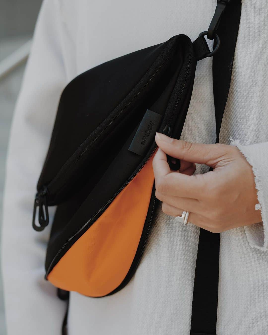 コートエシエルさんのインスタグラム写真 - (コートエシエルInstagram)「Moon-shaped. Silky feel. Meet our HALA L: a practical crossbody bag for your everyday needs 🧡 Not to mention the ADDA shoulder strap that you can also wear separately. Check out more: link in bio. / ph. @chloealyshea 📸 . . . . #coteetciel #designedinparis #streetmobs #urbanstreetwear #urbanstreetphotogallery #urbanandstreet #streetmagazines #bagdetails #detailsoftheday #detailsmatter #streetactivity #urbangathering #visualarchitects #bagsaddict #bagscollection #estheticlabel #createcommune #urbanaisle #killyourcity #tonekillers #popoforange #streetshared #bagoftheday #bagfashion #bagsandpurses #bagsarelife」5月21日 5時00分 - coteetciel