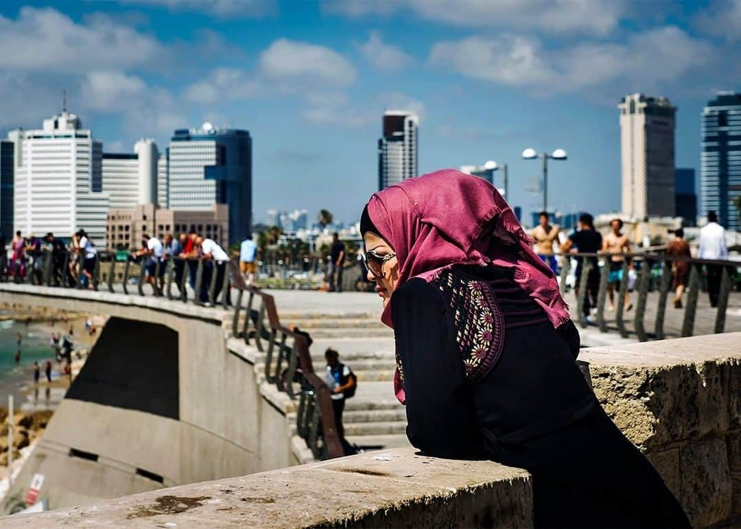 National Geographic Travelさんのインスタグラム写真 - (National Geographic TravelInstagram)「Photo by @dina_litovsky | A woman looks over the port of Jaffa, the oldest part of Tel Aviv, Israel, with the modern city in the background. Jaffa, with its sweeping views and cobblestone streets, is one of my favorite parts of the eclectic city. For more images, follow me @dina_litovsky.」5月23日 21時07分 - natgeotravel