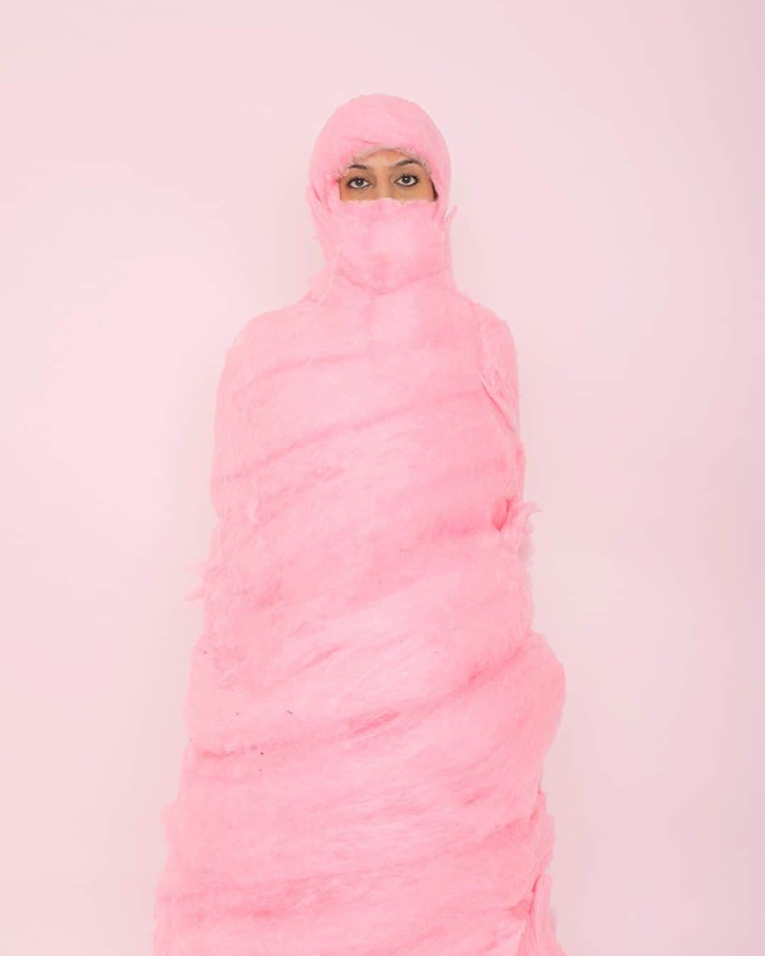 TED Talksのインスタグラム：「This is less cotton candy — and more like caught in candy! As a child in Afghanistan, artist Behnaz Babazadeh grew up wearing a traditional headscarf. But when her family moved to the US, she faced discrimination because of it. Today, Babazadeh wants to challenge the misconceptions about burkas and headscarfs as objects to be feared or symbols of oppression. To spark this conversation, she began taking self-portraits while wrapped in sweets to force people to question their beliefs. See more of her eye-catching series — which also features gummy bears and fruit roll-ups — at the link in our bio.」