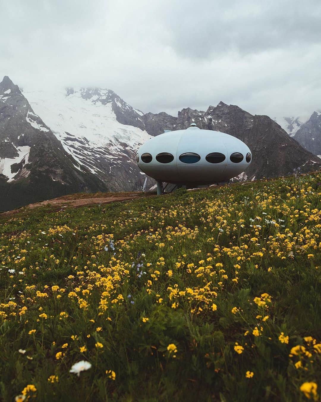 Instagramさんのインスタグラム写真 - (InstagramInstagram)「#HelloFrom a Futuro House. We’re dreaming of this out-of-this-world structure, tucked into the Caucasus Mountains. 🌼⁣ ⁣ Designed by Finnish architect Matti Suuronen, there is nothing supernatural about this flying saucer. Less than 100 of these prefabricated “portable” ski chalets were built in Finland, and this particular pod first landed on the Mussa-Achitara ridge in the 1970s. ⁣ ⁣ Today, you can find Futuro Houses around the world, and the one in Dombay is a functioning hotel.⁣ ⁣ Photo by @ted.ns」5月25日 1時04分 - instagram