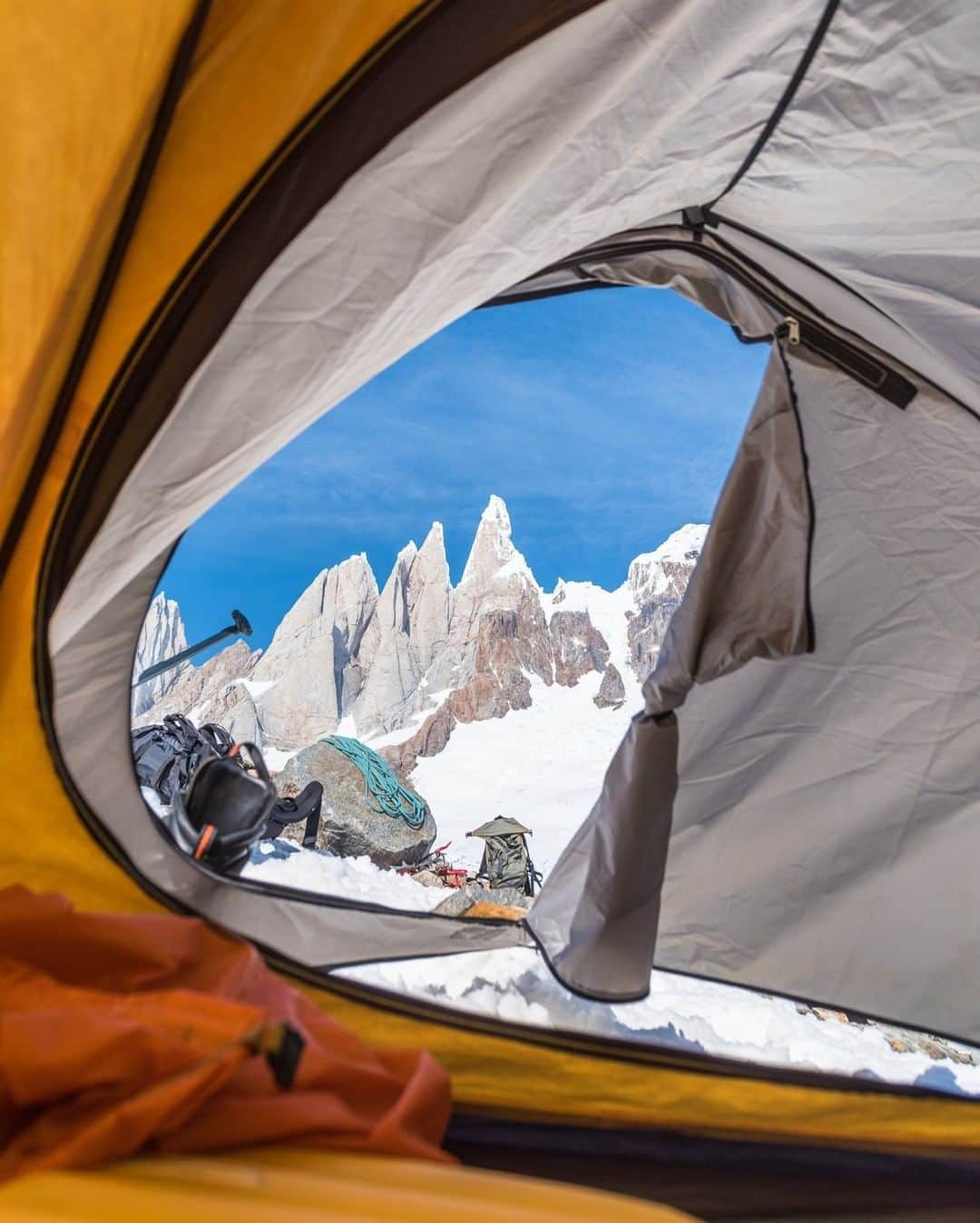 National Geographic Travelさんのインスタグラム写真 - (National Geographic TravelInstagram)「Photo by @michaelclarkphoto | The west face of Cerro Torre—as seen here through the tent door—rises above the Patagonia Ice Cap near El Chalten, Argentina. Images of peaks framed up out the door of a tent are pretty common, and I try to resist the urge, but in this case with Cerro Torre looming out there I had to snap a few images. Camping behind Cerro Torre was like camping in the throne room of the mountain gods. One of these days I will hopefully get back there and actually do some climbing. #cerrotorre #chile #patagoniaicecap #patagonia」5月25日 13時10分 - natgeotravel