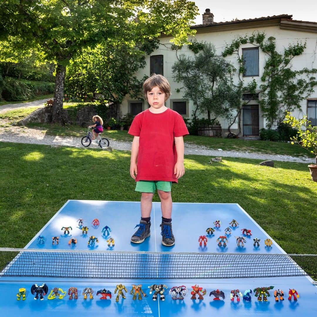 のインスタグラム：「Photo by @gabrielegalimbertiphoto | Last week I took a new photo for my Toy Stories series: This is Ian Woods, 5, in Pratolino, Tuscany, Italy. Toy Stories is an ongoing project—wherever I travel in the world, I take portraits of children with their favorite toys. I have spent more than two years visiting over 50 countries, and I've recorded the spontaneous and natural joy that unites kids, despite their diverse backgrounds. Whether the child owns a veritable fleet of miniature cars or a single stuffed monkey, the pride that they have is moving, funny, and thought-provoking. Follow me @gabrielegalimbertiphoto for more photos and stories #toys #play #kids #child #children」