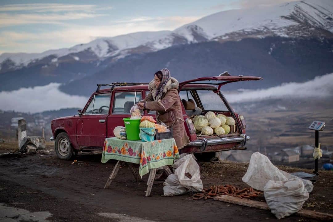 National Geographic Travelさんのインスタグラム写真 - (National Geographic TravelInstagram)「Photo by @AnushBabajanyan | Irina Novikova, 58, has been spending her days on the road next to Fioletovo village in Armenia for over five years, selling pickled and fresh goods out of her car. One of the ethnically Russian Molokan people living in the village, she is lively and vibrant. "Everyone knows me and I want my customers to be satisfied,” she says.  For more from Armenia and beyond, follow me @AnushBabajanyan. #Armenia #Molokans」6月26日 9時05分 - natgeotravel