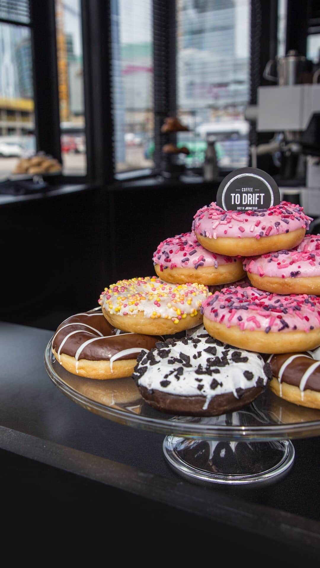 BMWのインスタグラム：「Hungry for Donuts? 🍩  We’ve got you covered. Join us on the grounds of the BMW Driving Experience, and let’s have a real talk about the how and why of drifting action.  #NationalDonutDay #DriftHappens #BMW #NationalDoughnutDay #doughnut #donut #drift #🍩 __ BMW M4 Coupé with Competition Package: Fuel consumption in l/100 km (combined): 10.0 [9.3]. CO2 emissions in g/km (combined): 227 [213]. Further information: www.bmw.com/disclaimer. Acceleration (0-100 km/h): 4.2 s [4.0 s]. Power: 331 kW, 450 hp, 550 Nm. Top speed (limited): 250 km/h (with optional M Drivers Package: 280 km/h). The figures in brackets refer to the vehicle with seven-speed M double-clutch transmission with Drivelogic.」