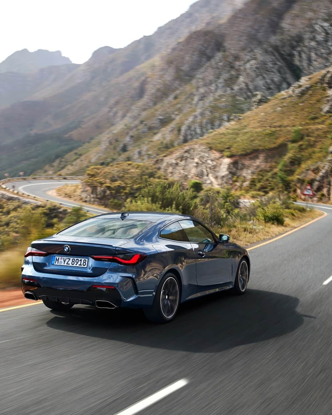 BMWのインスタグラム：「Not for those who are afraid of corners. #THE4 #BMW #4Series #EnjoyEveryEdge __ BMW M440i xDrive Coupé: Fuel consumption in l/100 km (combined): 7.1–6.8. CO2 emissions in g/km (combined): 163–155.  Further information: www.bmw.com/disclaimer. Acceleration (0-100 km/h): 4.5 s. Power: 275 kW, 374 hp, 500 Nm. Top speed (limited): 250 km/h.」