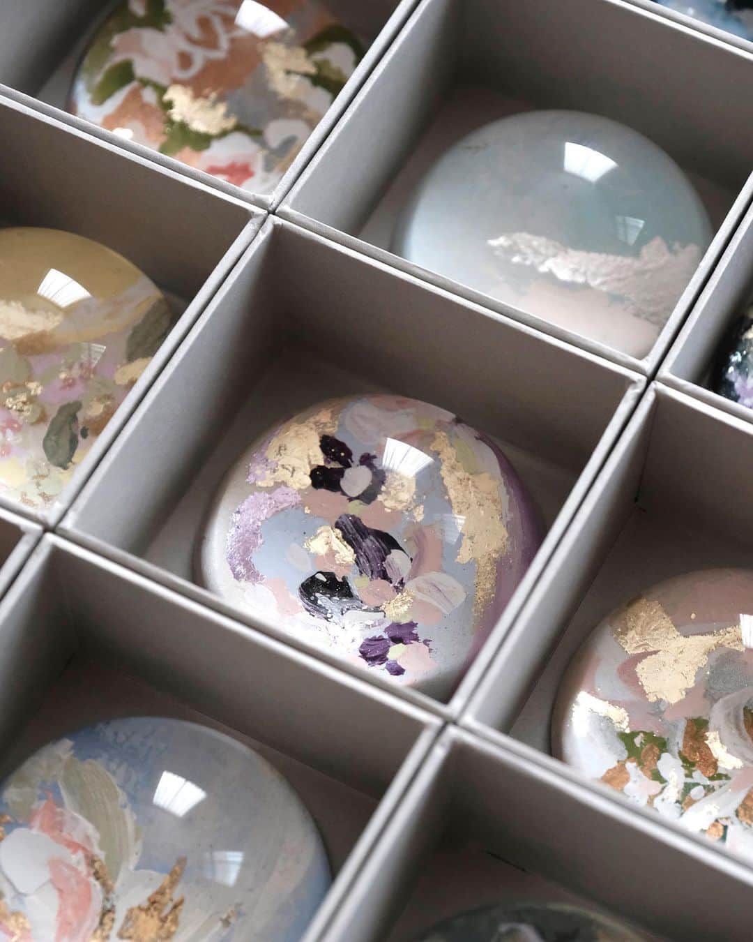 のインスタグラム：「Happy monday! This week will be a busy week preparing the new collection launch for these handpainted paperweight object.  Stay tuned! — #paperweight #domeproject  #truffypi #painting #orangevening #mixmedia #water #glass #calligraphystyling #tabletop #stationery #カリグラフィースタイリング  #artobject #waterdrop #bespokestationery #interiorobjects」