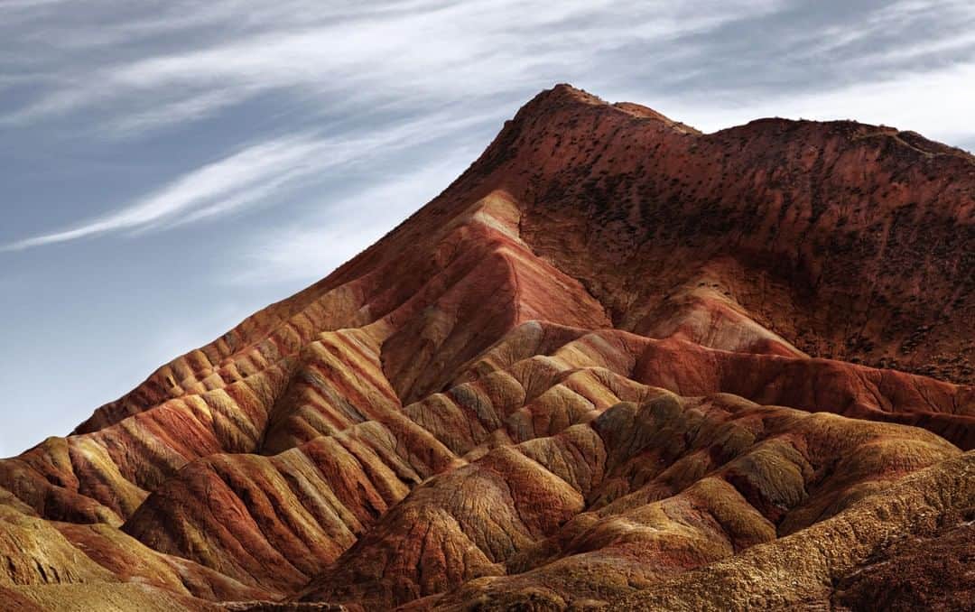 Canon Asiaのインスタグラム：「Is it a quilted blanket? Is it a loaf of bread? No, it's actually a photograph of the rainbow mountains at the Danxia Landforms in Zhangye, China!⁣ .⁣ We're in awe 😮 of the coordinated colours, the fascinating textures, and how the photo invites viewers to take a closer look and examine in detail. What did you first make of this image at first glance?⁣ .⁣ 📷 Image by @amdprasad on Instagram shot using the Canon EOS 5D Mark II | EF24-105mm f/4L IS USM | f/8 | ISO 200 | 1/400s | 73mm⁣ .⁣ Want your photos to be featured too? Tag them with #canonasia or submit them on My Canon Story, link in bio!⁣ .⁣ #canonasia #photography #explore #landscape #mountain #colours #canon #composition #texture #lens #inspiration #nature #danxia」