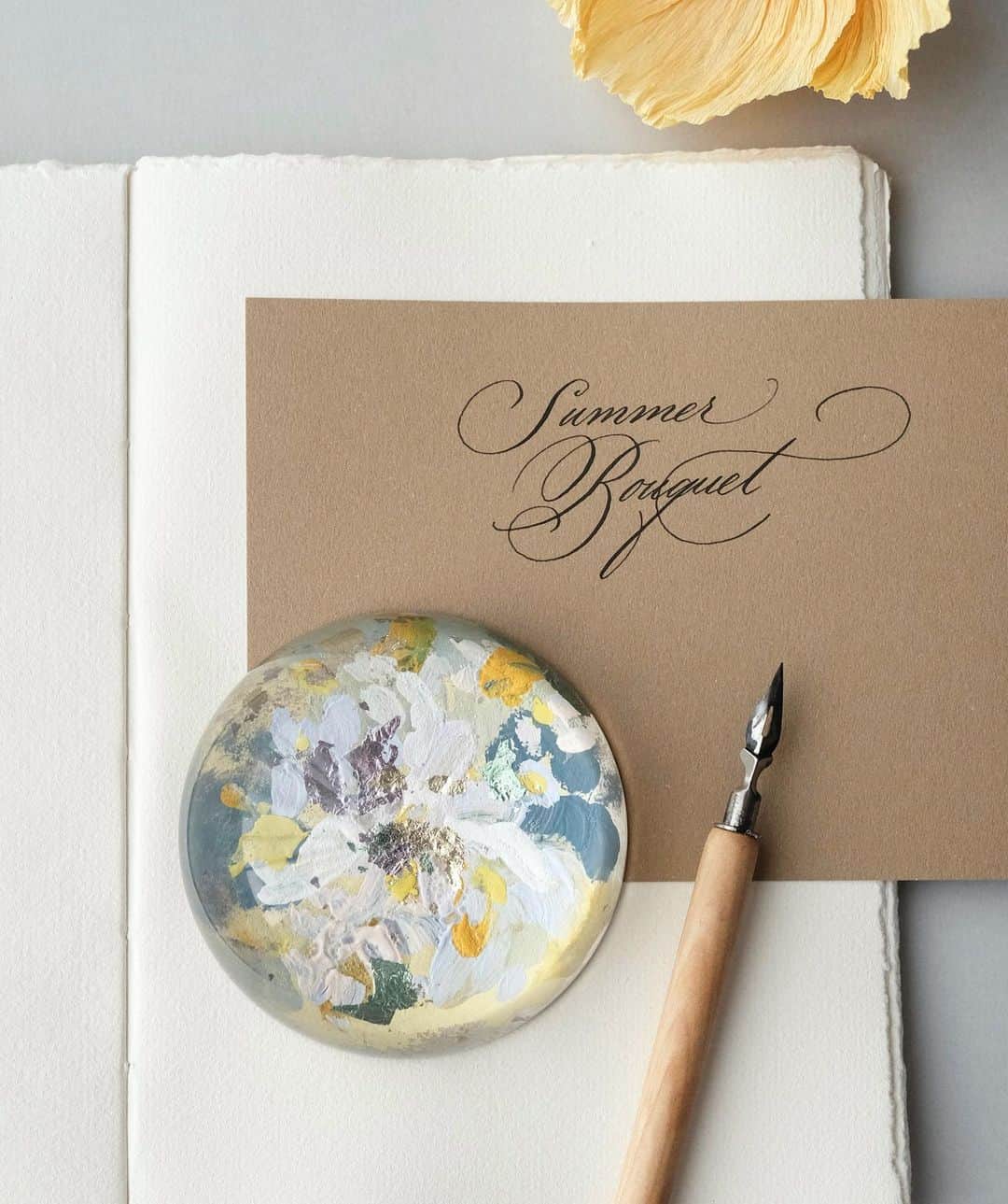 のインスタグラム：「Summer Bouquet vibe from the new collection — #paperweight #domeproject #thesummerfields #truffypi #painting #paperweight #mixmedia #glass #calligraphystyling #tabletop #stationery #カリグラフィースタイリング  #artobject #waterdrop #bespokestationery #interiorstyling #art #calligraphylifestyle」