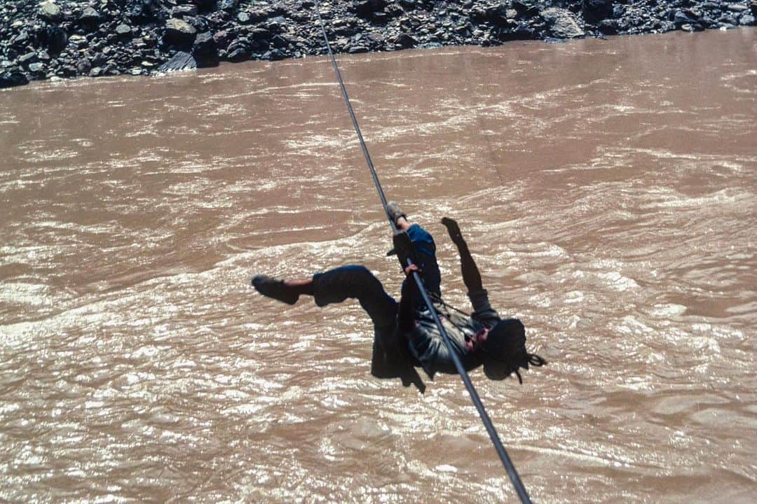 Michael Yamashitaさんのインスタグラム写真 - (Michael YamashitaInstagram)「Untamed River — From a trickle to a torrent, a river runs through it: to Tibetans, it’s known as Dza Chu, or the River of Stones, and to the Chinese it’s the Lancang Jiang, the Turbulent River. As it follows its 2600 mile journey to the sea, the river runs through valleys and gorges plunging ever downwards. In sparsely populated northern Yunnan, the Mekong drops an incredible 15,000 feet, making it a formidable obstacle to cross. Bridges are few and far-between, so the most common method of crossing is by zip line — a single strand of cable strung at a steep angle over the river. Using a sling attached to a pulley, the rider hooks on the cable and with the help of gravity slides down the high wire as if aboard an adventure park ride, suspended several hundred feet over the churning white water to get to the other side. #dzachu #tibetan #lancangjiang #yunnanprovince #mekongriver  A limited number of signed copies of Mike’s out-of-print book “A Journey on the Mother of Waters: Mekong” are available to purchase from our website michaelyamashita.com or the link in our profile.」6月13日 10時21分 - yamashitaphoto