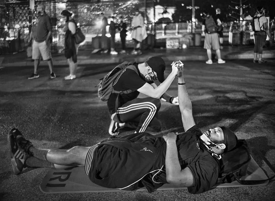 thephotosocietyさんのインスタグラム写真 - (thephotosocietyInstagram)「Photo by @ScottGoldsmithPhoto/ Washington DC/  @thephotosociety  It was late last Friday night when protesters started drifting away from the White House.  Yoga mats were passed out for those wishing to sleep overnight. It was a peaceful scene. The moment above happened when the kneeling man stopped to check the man on the ground. He was ok. They exchanged a few words and began to pray. This is the type of unity we need going forward to move beyond racial injustice. My heart was warmed by this simple and kind act. Last week seemed like a pivotal time in our nation's history. I hope so. Time will tell.  #together #kind #BLM #Protest #Saytheirnames #unity #love」6月13日 5時28分 - thephotosociety