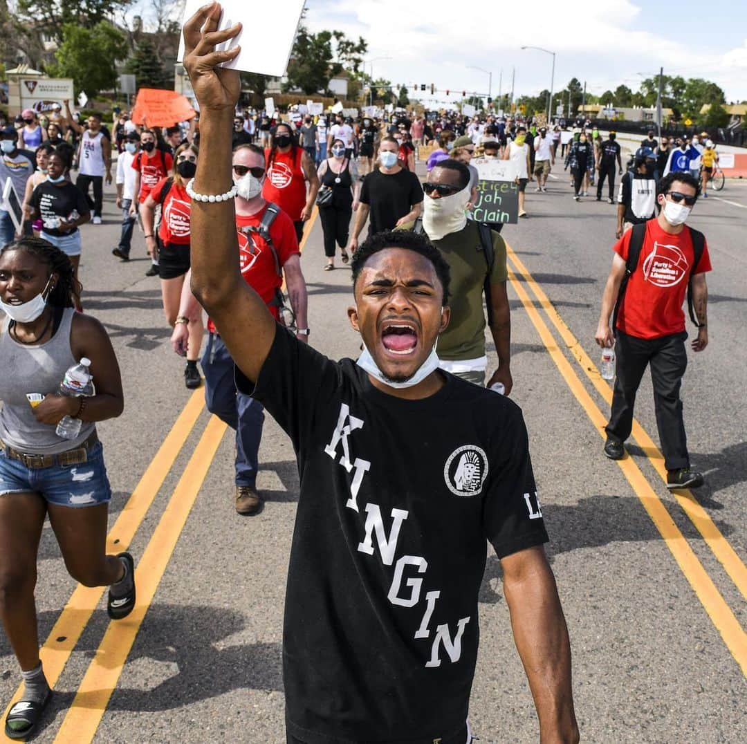 TIME Magazineさんのインスタグラム写真 - (TIME MagazineInstagram)「Christian Jones, center, marches with other protesters demanding justice for Elijah McClain in Aurora, Colo., on June 27. Protesters on Saturday shut down I-225 in both directions. Governor Jared Polis confirmed two days earlier that he instructed the state’s top prosecutor to open a new probe into the death of the 23-year-old Black man. Last August, McClain was detained by police while walking home and listening to music after someone called to report a "suspicious person." At one point, after McClain was put in what the police report describes as a “carotid control hold,” or a type of chokehold, he is heard saying, "I can’t breathe. Please stop." He was later injected with ketamine by a fire medic and suffered cardiac arrest on the way to the hospital. McClain was taken off life support six days later. "Black men and women are killed by law enforcement in this country more often than any of us would like to ever admit and it shouldn’t require public outrage for people to get justice," Mari Newman, an attorney for the McClain family, tells TIME. "The family and I called for an independent investigation last fall and all we heard was crickets." In the last photograph: Colorado state representative Leslie Herod, left, hugs McClain's mother, Sheneen McClain, during a rally outside police headquarters. Read more at the link in bio. Photographs by @michaelciaglo—@gettyimages」6月29日 4時11分 - time