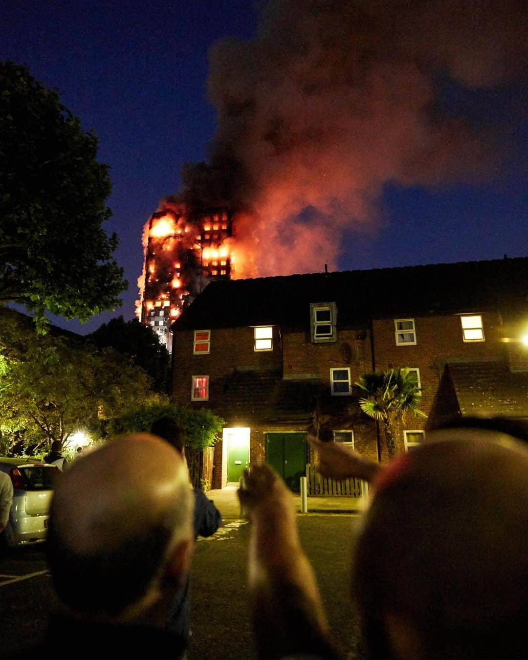 Jackson Harriesさんのインスタグラム写真 - (Jackson HarriesInstagram)「Trigger Warning ⚠️ I will never forget the early hours of June the 14th three years ago today. I was working late when I heard a helicopter flying around overhead. It's not an unusual sound in London, but the helicopter was circling particularly low. Out of curiosity I went to get a better look from my bedroom window and could hardly process what I saw. Grenfell tower was a blazing inferno. In complete shock, I got dressed, and ran out into the street. The tower had already been burning a little while and a small crowd had gathered round. I will never forget the look of grief on their faces. It was only then that I began to process that people were trapped inside. We stood in shock and watched helplessly as fire engulfed the building.  72 people died that night. Victims of a terrible case of neglect. An inquiry later discovered that the cladding recently placed on the building to make it look ‘more appealing’ didn’t conform with building regulations, and was central to the spread of the fire. To this day no one has been charged with a crime and no justice has been served. The people of Grenfell were, and continue to be let down by a system that values some lives less than others.  Every month on the 14th, a silent vigil takes place in our neighbourhood. It is a powerful reminder of the grief and devastation that ripped through the community. The skeleton of Grenfell still stands, covered in a banner that reads ‘in our hearts’. Today I’m thinking of all the bereaved and the survivors. We will never forget. #JusticeforGrenfell」6月15日 0時27分 - jackharries