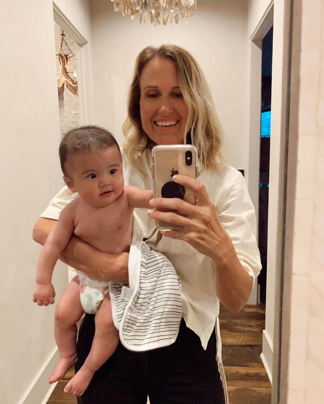 コリー・ロバートソンさんのインスタグラム写真 - (コリー・ロバートソンInstagram)「I love to come around the corner of my bathroom and see my grand babies faces in this mirror.  They get excited every time they see themselves and it makes me happy every time I see them in my arms.  They are getting old enough now that they remember this mirror is here and start kicking their legs even before we round the corner. ⠀ ⠀ I’ve been reading James over and over again throughout all of the hard things that 2020 has brought. There is so much there that speaks to what we are going through right now. I have also been listening and reading a lot to things online and in the news and honestly sometimes I feel like I don’t know what’s up or down, right or wrong, truth or lies. ⠀⠀ ⠀⠀ BUT thankfully God’s word has proven itself once again to be always good and true. In His word I find truth and peace, strength and confidence, forgiveness and compassion, challenge and grace, freedom and love. Here’s an exert from James to soak on: ⠀⠀ “My dear brothers and sisters, take note of this: Everyone should be quick to listen, slow to speak and slow to become angry, because human anger does not produce the righteousness that God desires. Therefore, get rid of all moral filth and the evil that is so prevalent and humbly accept the word planted in you, which can save you. Do not merely listen to the word, and so deceive yourselves. Do what it says. Anyone who listens to the word but does not do what it says is like someone who looks at his face in a mirror and, after looking at himself, goes away and immediately forgets what he looks like. But whoever looks intently into the perfect law that gives freedom, and continues in it—not forgetting what they have heard, but doing it—they will be blessed in what they do. Those who consider themselves religious and yet do not keep a tight rein on their tongues deceive themselves, and their religion is worthless. Religion that God our Father accepts as pure and faultless is this: to look after orphans and widows in their distress and to keep oneself from being polluted by the world.”⠀⠀ ‭‭James‬ ‭1:19-27‬ ‭NIV‬‬」6月15日 6時32分 - bosshogswife