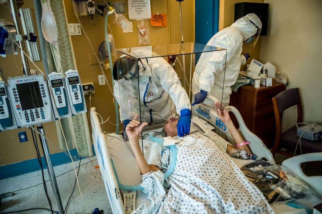 TIME Magazineさんのインスタグラム写真 - (TIME MagazineInstagram)「José Antonio Blanco, who was on a ventilator for weeks and nearly died, gasps as he takes his first breaths on his own after his tracheostomy tube was removed at Wyckoff Heights Medical Center in Brooklyn on May 26. A thick glass wall around Blanco’s head protected Dr. Parvez Mir and Dr. Asif Khan from infection as they took out the tube. "I've just been reborn," Blanco would tell the photographer. Wyckoff, with a capacity of around 350 beds, has treated more than 2,000 COVID-19 patients, the vast majority of them Latino and Black with poor health insurance or none at all. Almost 300 died. Nearly 200 Wyckoff workers became infected, and the virus took four of their lives. Read the full special report, Contagion of Fear, at the link in bio. Photograph by @meridithkohut for TIME」6月16日 4時47分 - time