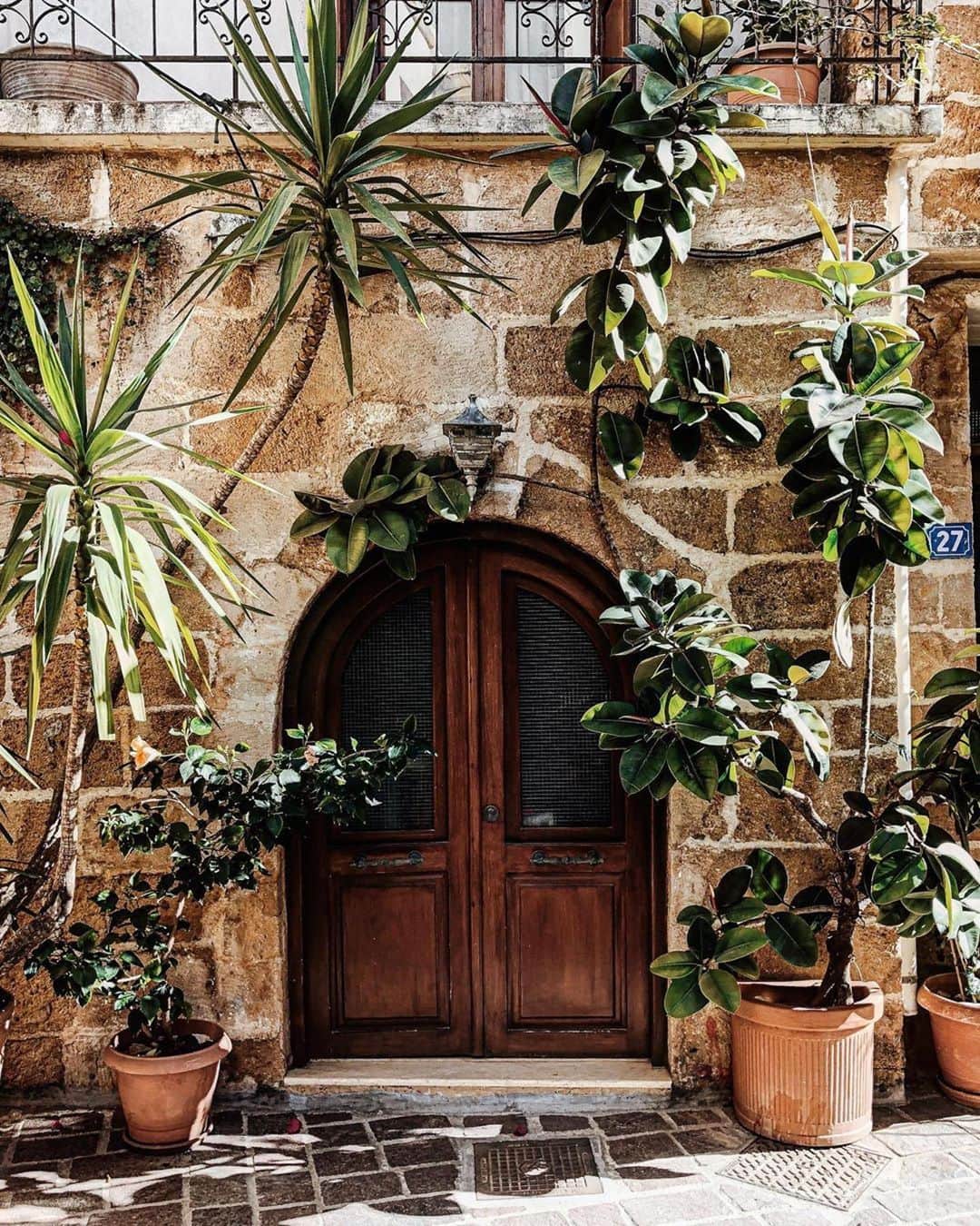 Lonely Planetのインスタグラム：「Today’s #lonelyplanet regram is a very inspiring doorway in Crete, Greece from @oncewaslost_ Does anybody have plans to travel here since they have announced reopening plans? Tag #lonelyplanet in your images for a chance to be featured on our feed.」
