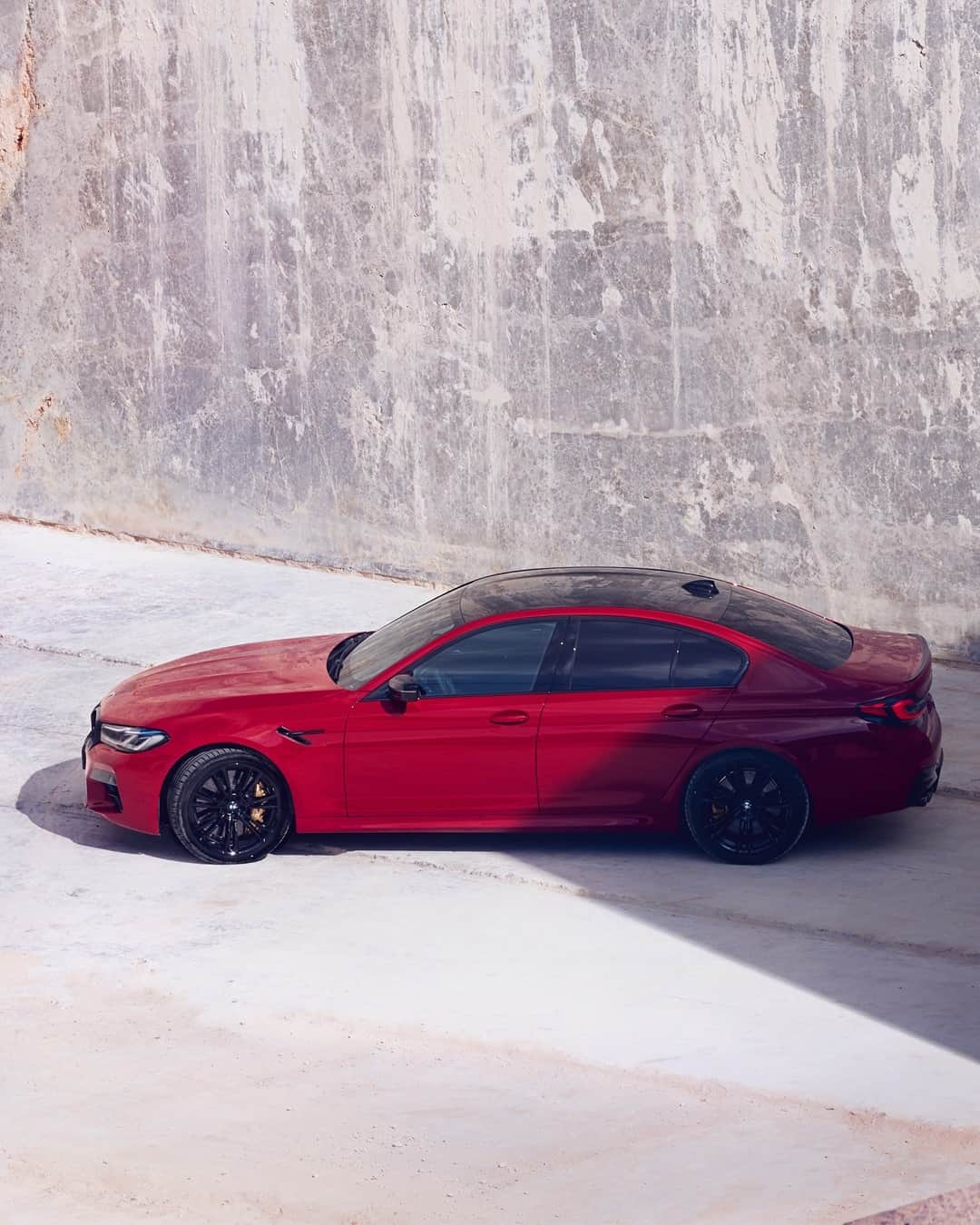 BMWのインスタグラム：「Red is the fastest color. Introducing the new BMW M5 Competition. #TheM5 #BMW #M5 #BMWM @BMWM __ BMW M5 Competition Sedan: Fuel consumption in l/100 km (combined): 10.6–10.5. CO2 emissions in g/km (combined): 242–239.  Further information: www.bmw.com/disclaimer. Acceleration (0-100 km/h): 3.3 s. Power: 460 kW, 625 hp, 750 Nm. Top speed (limited): 250 km/h (with optional M Drivers Package: 305 km/h).」